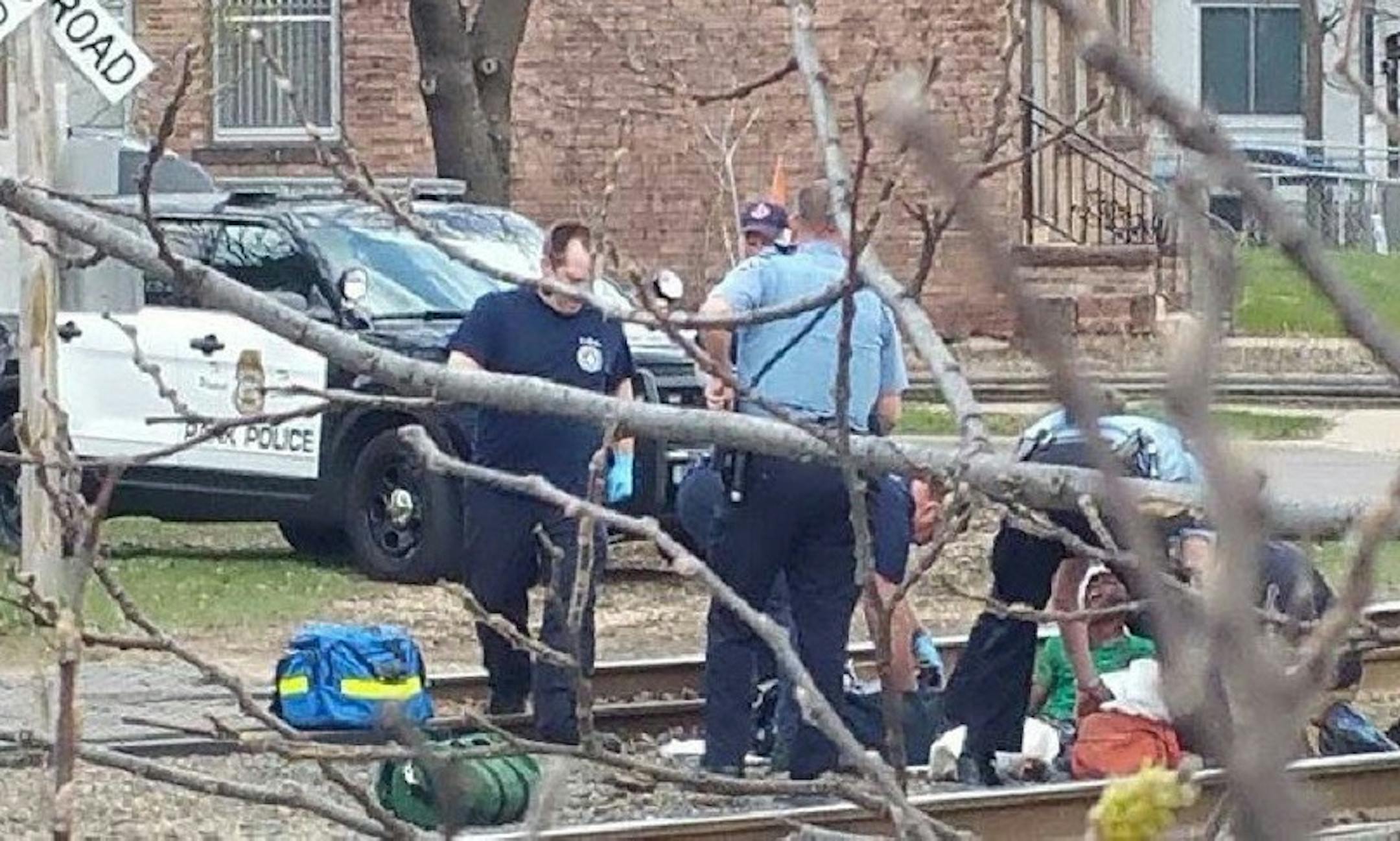 Emergency workers helped a boy after he was dragged and then run over by a train on Minneapolis' North Side.