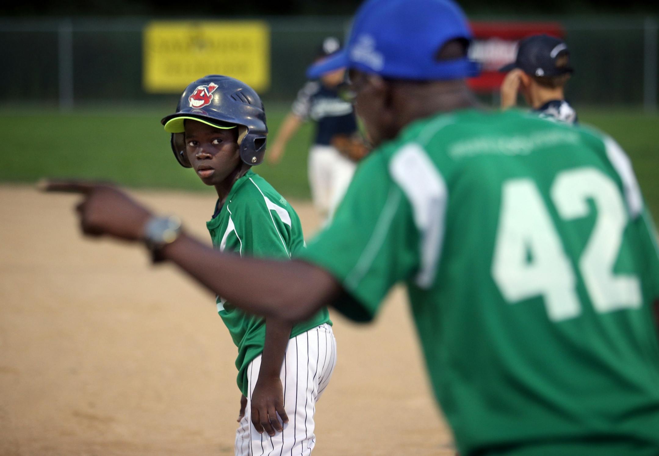 Bill Sagbo, left, takes instructions from coach Arnaud Adodo during their scrimmage against the Robbinsdale 10-year-old all-star team at Lakeview Terrace Park on Tuesday, August 2, 2016 in Robbinsdale.