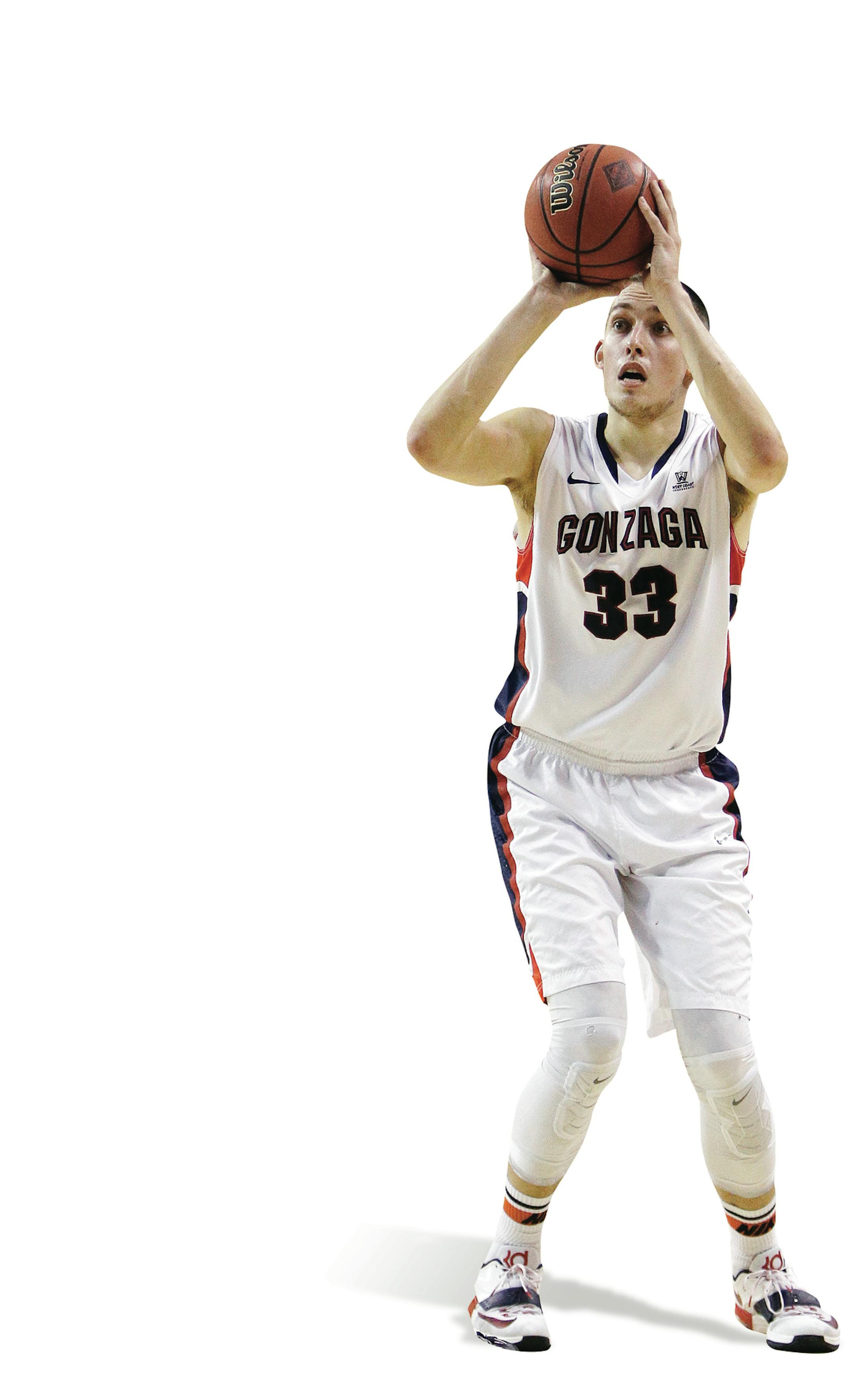 Gonzaga's Kyle Wiltjer (33) takes a shot against St. Thomas Aquinas&#xed; Shaquille McFarlan (24) during the first half of an NCAA college basketball game in Spokane, Wash., Saturday, Nov. 22, 2014. (AP Photo/Young Kwak) ORG XMIT: OTK
