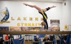 A member of the Laker gymnastics team shows off her skills.