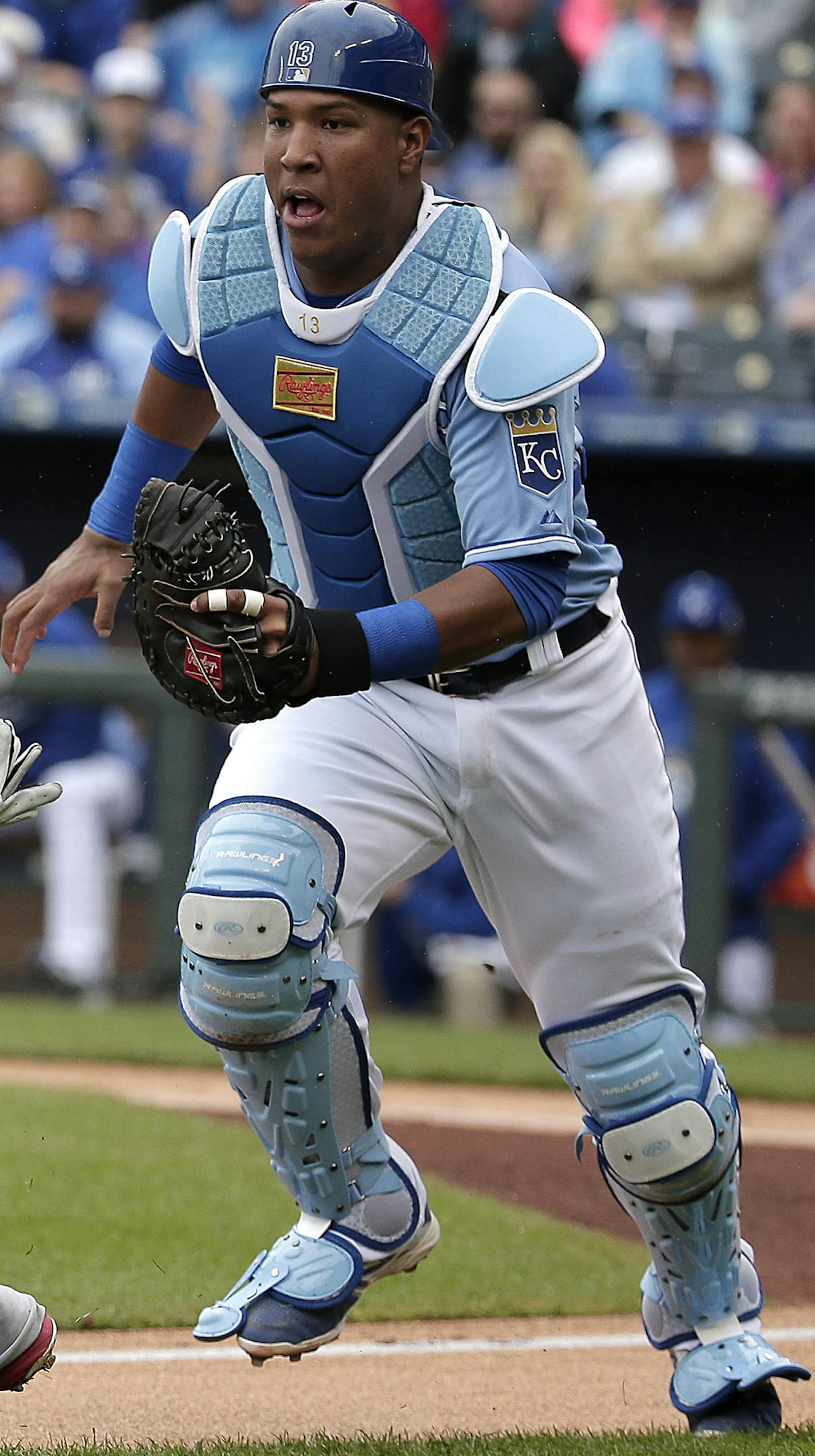 St. Louis Cardinals' Jhonny Peralta (27) is chased down by Kansas City Royals catcher Salvador Perez after being caught in a rundown between third and home during the first inning of a baseball game Sunday, May 24, 2015, in Kansas City, Mo. (AP Photo/Charlie Riedel) ORG XMIT: MOCR105