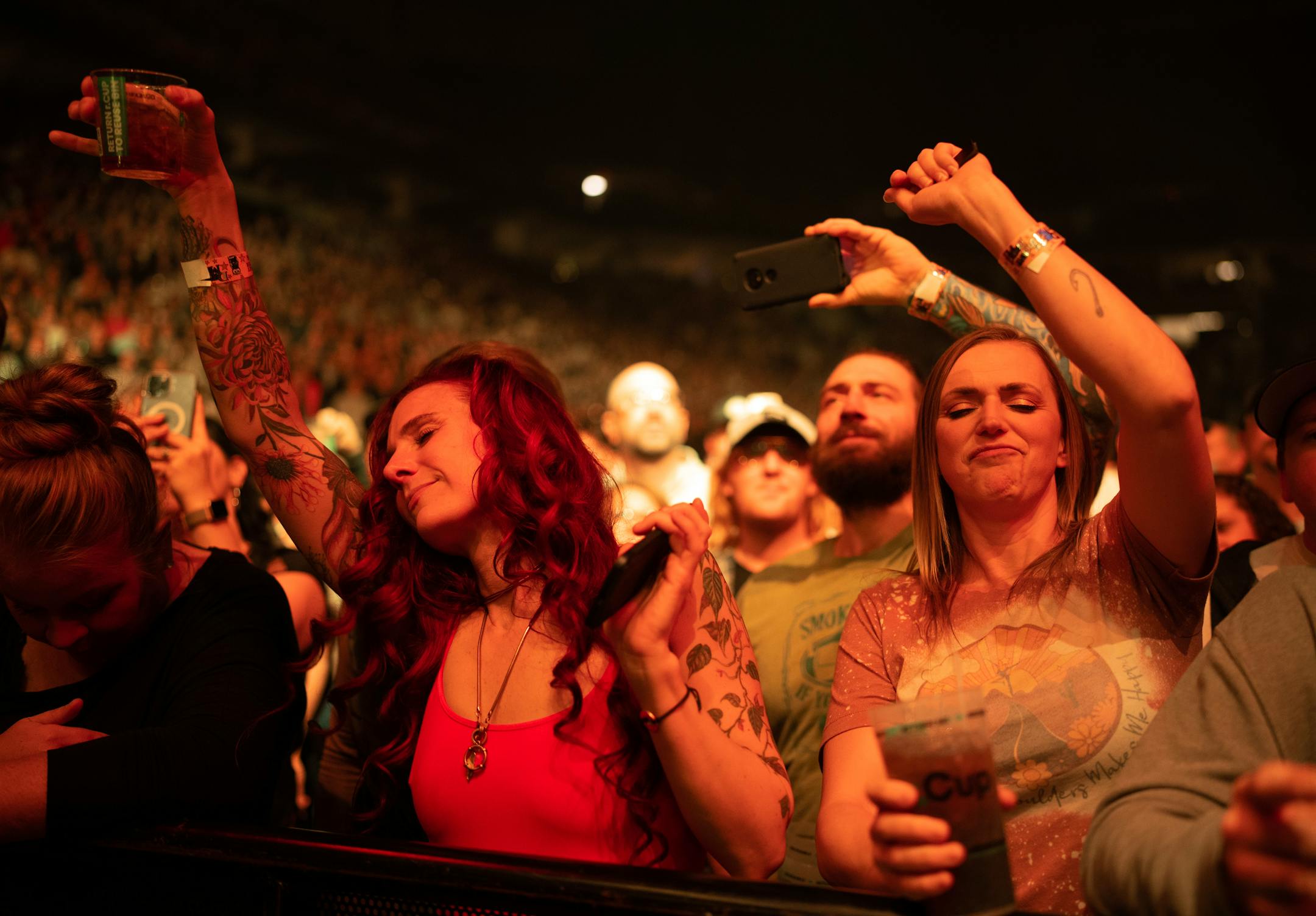 Front row fans grooved to Dave Matthews performing with his band early in their show.