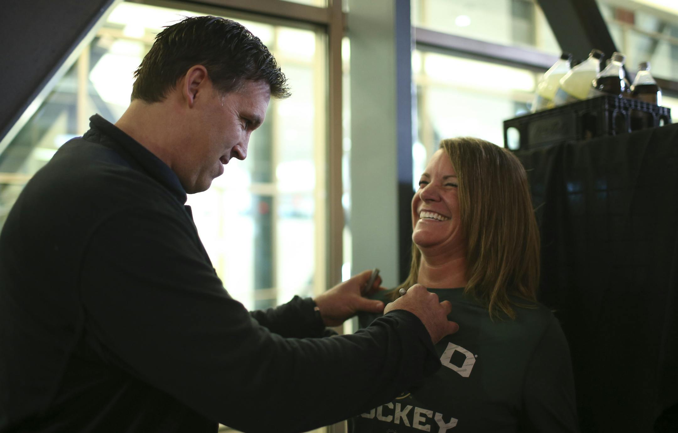 Former Wild player Brian Rolston signed the shirt of Valerie Hudy of Chanhassen before Monday night's game. ] JEFF WHEELER ï jeff.wheeler@startribune.com The Minnesota Wild and the St. Louis Blues met in game 3 of their NHL playoff series Monday night, April 20, 2015 at Xcel Energy Center in St. Paul.