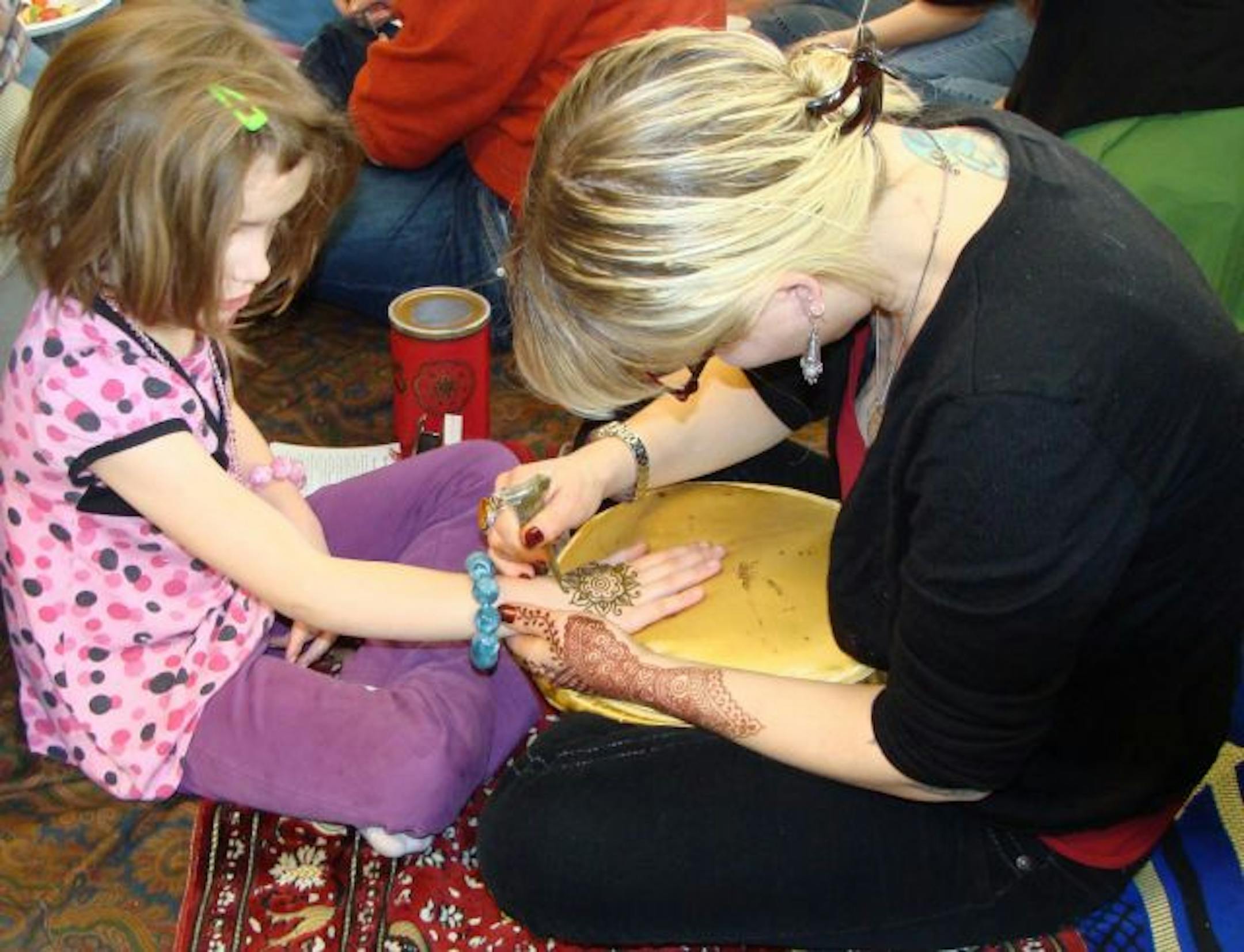 Frida Hilbrich, 6, from St. Paul and Angela Skrade of Ancient Traditions Mehndi.