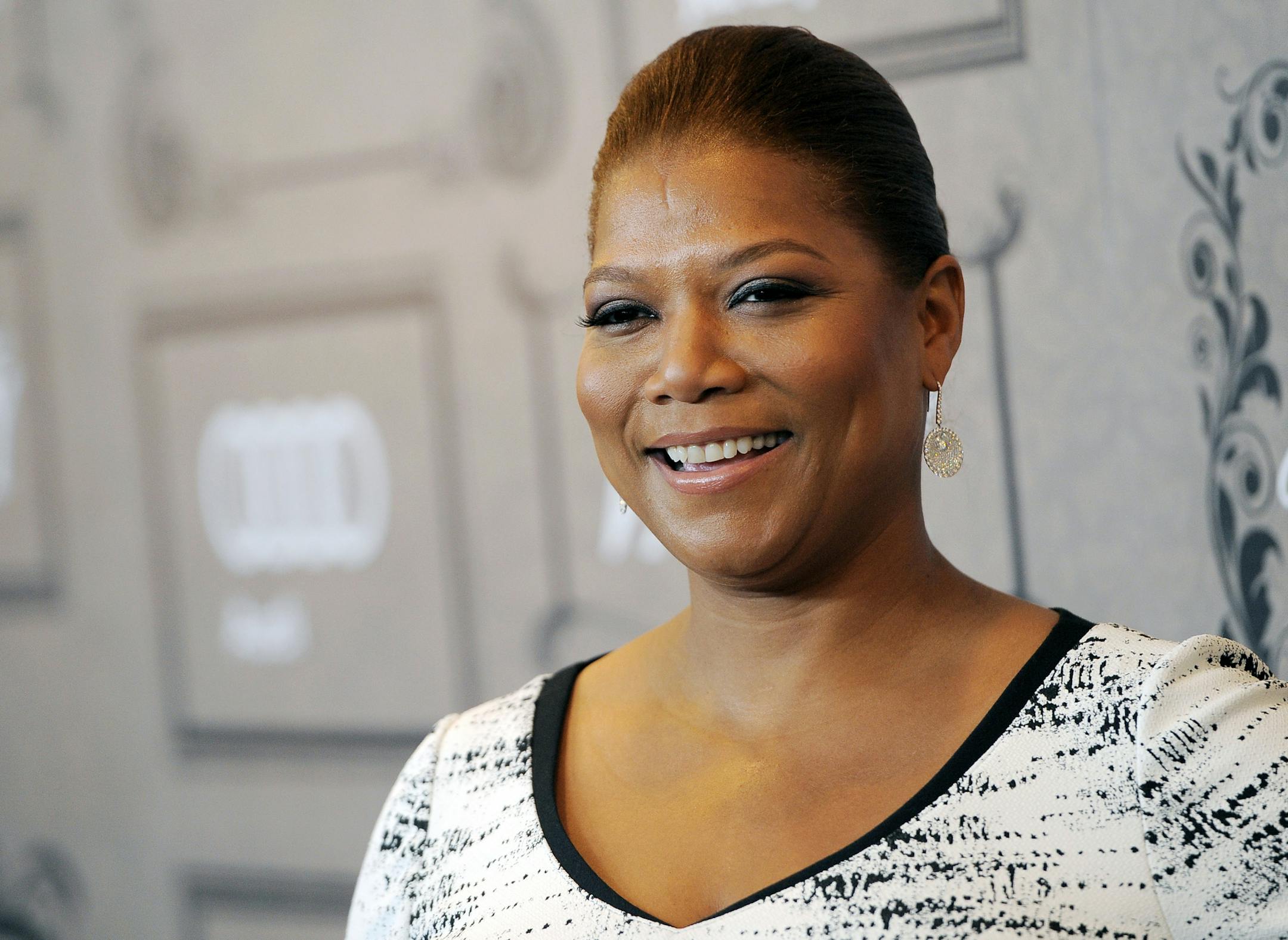 FILE - This Oct. 5, 2012 file photo shows Queen Latifah at Variety's 4th annual Power of Women event in Beverly Hills, Calif. Latifah's new talk show, "The Queen Latifah Show" comes out from Sony Pictures Television in September 2013. (Photo by Chris Pizzello/Invision/AP, file) ORG XMIT: MIN2013090414564150