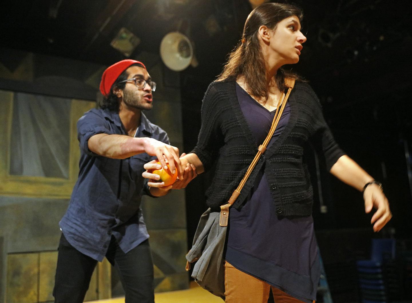 Owais Ahmed and Elyse Ahmad struggled over an orange as they rehearsed a scene from "Orange" at Mixed Blood.