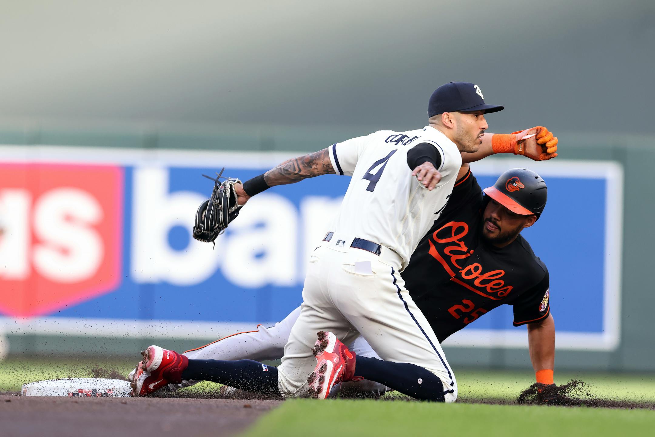 Twins shortstop Carlos Correa looks for the call after tagging out Baltimore's Anthony Santander on a steal attempt during the first inning Friday