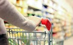 Woman shopping at the supermarket. istock photo