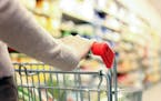 Woman shopping at the supermarket. istock photo