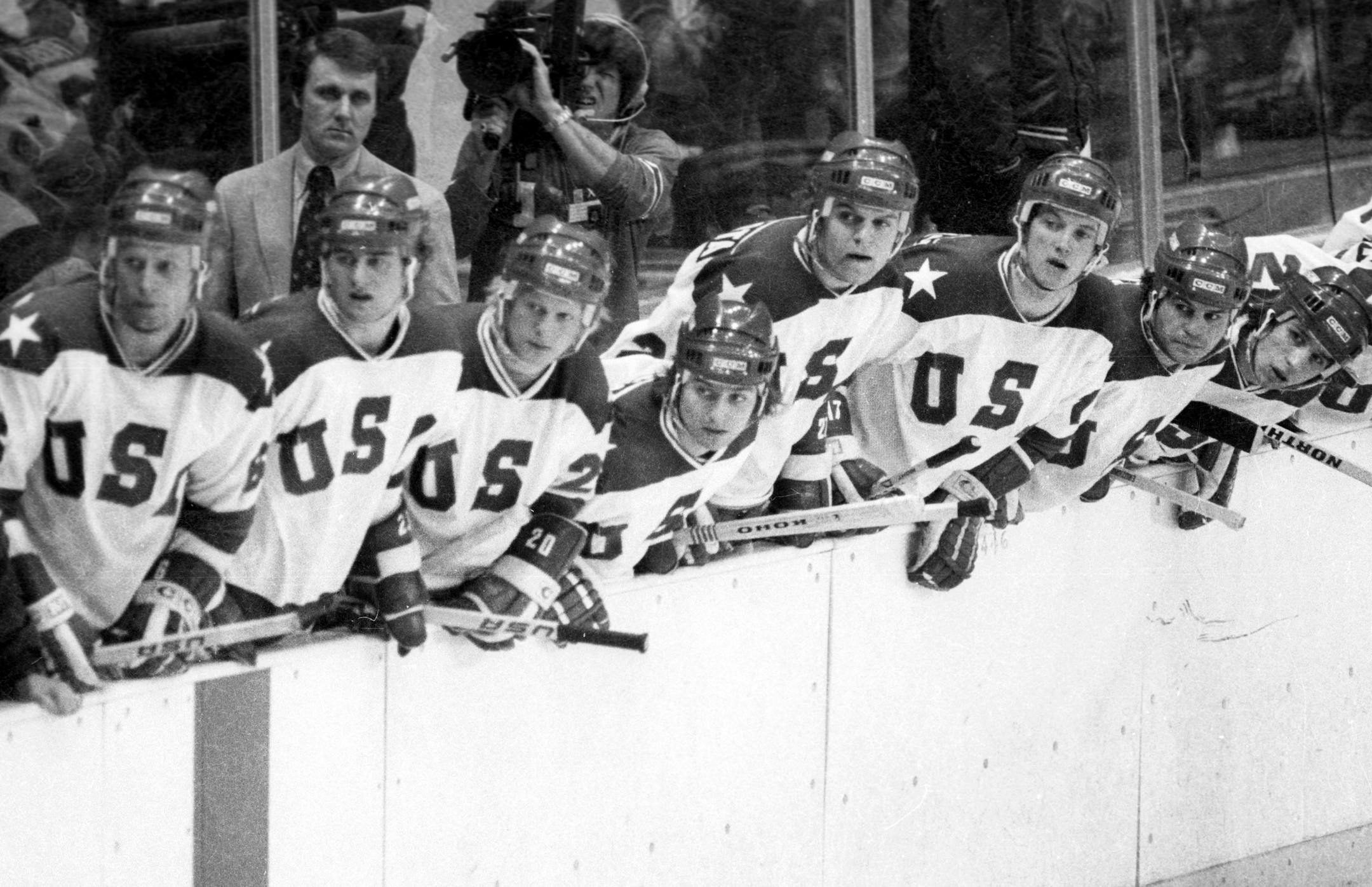 Team USA hockey coach Herb Brooks and players followed the action on the ice during a medal round game vs. the Soviet Union at the 1980 Winter Olympics in Lake Placid, N.Y.