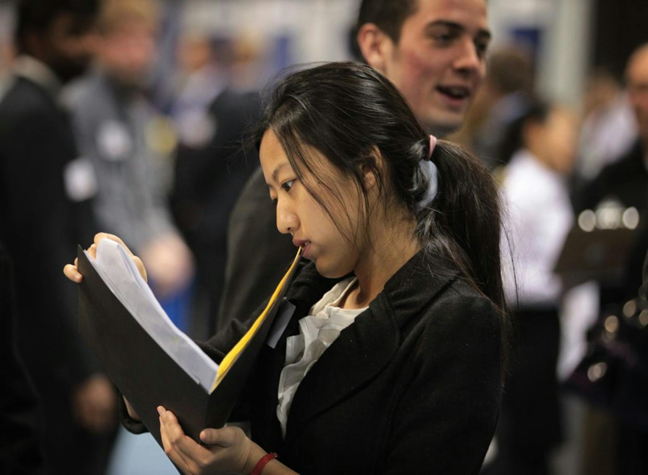 Shuo Zhao attended a 2012 job fair at the Minneapolis Convention Center.