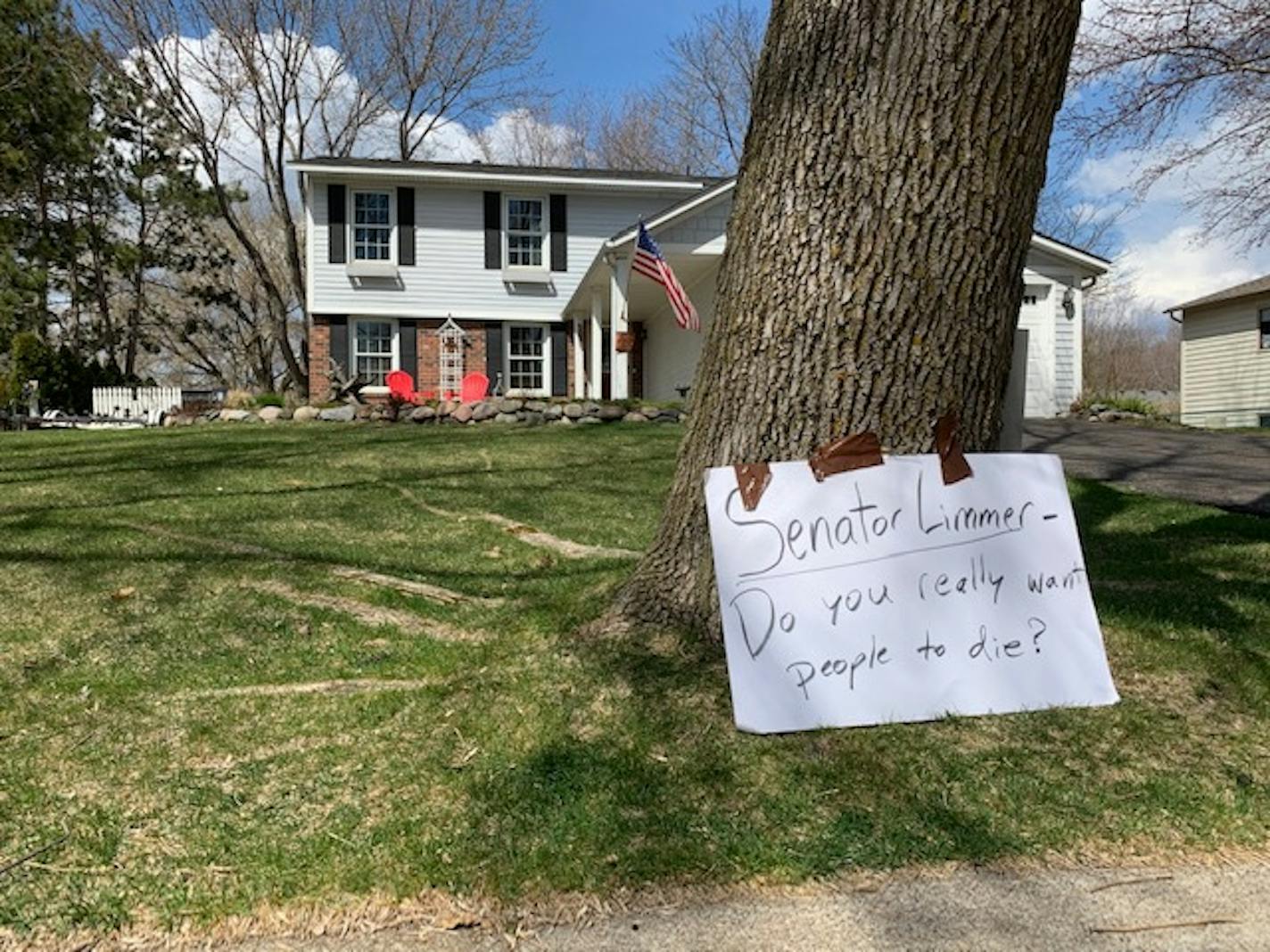 Criminal justice advocates protested outside the Maple Grove home of Sen. Warren Limmer, chairman of Senate Judiciary Committee, on Saturday, April 25, after he declined to hear a bill that would expand Corrections Commissioner Paul Schnell's authority to release nonviolent inmates.