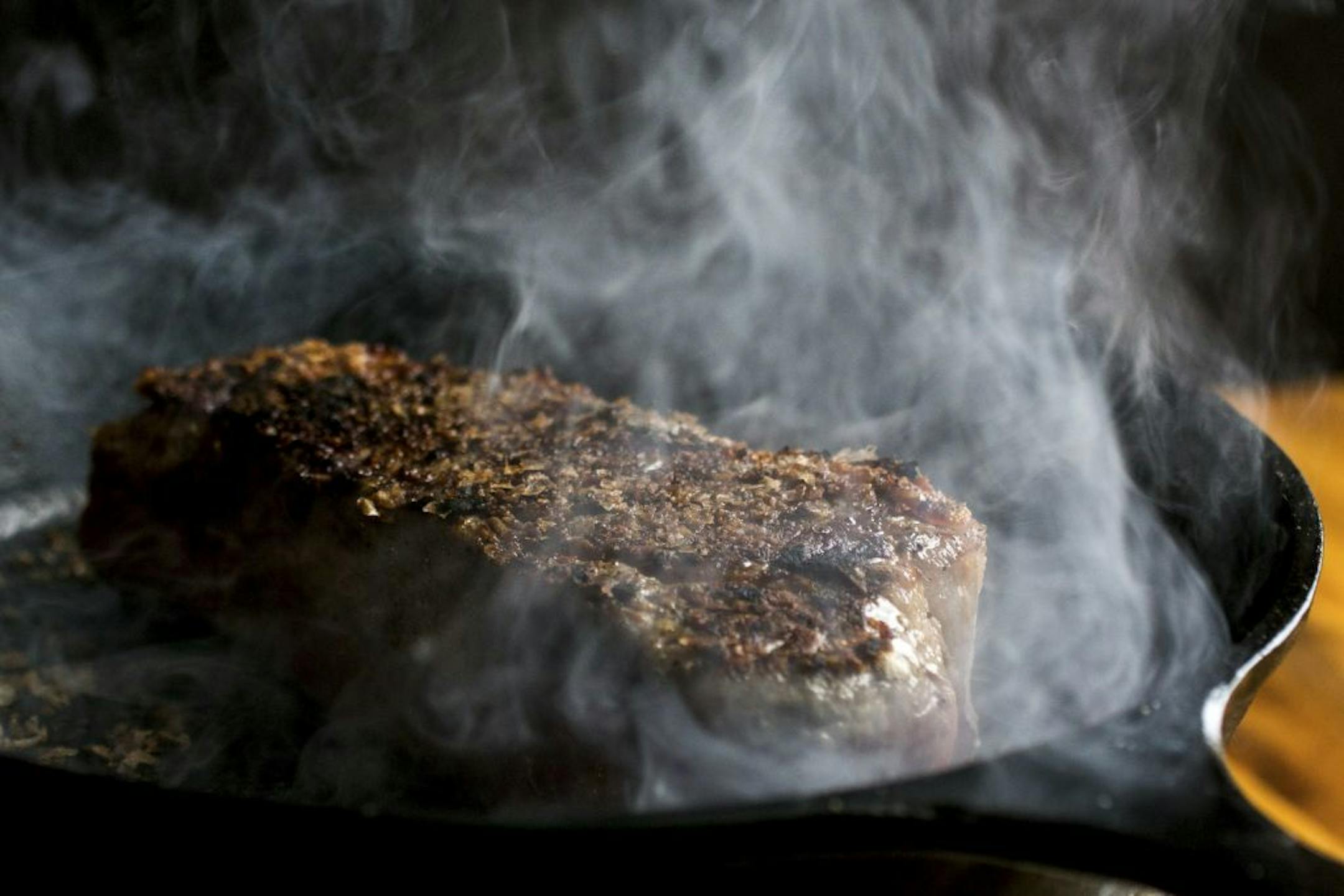 Searing with a cast-iron skillet, which is the only way to get a hot enough surface on a stovetop at home, in New York, May 8, 2014. You truly don't need a grill to cook a great steak: savory, salty, encased in a bark-like crust, and you don't need to marinate or dry-rub, or know your way around a beef cut chart to buy a good one.