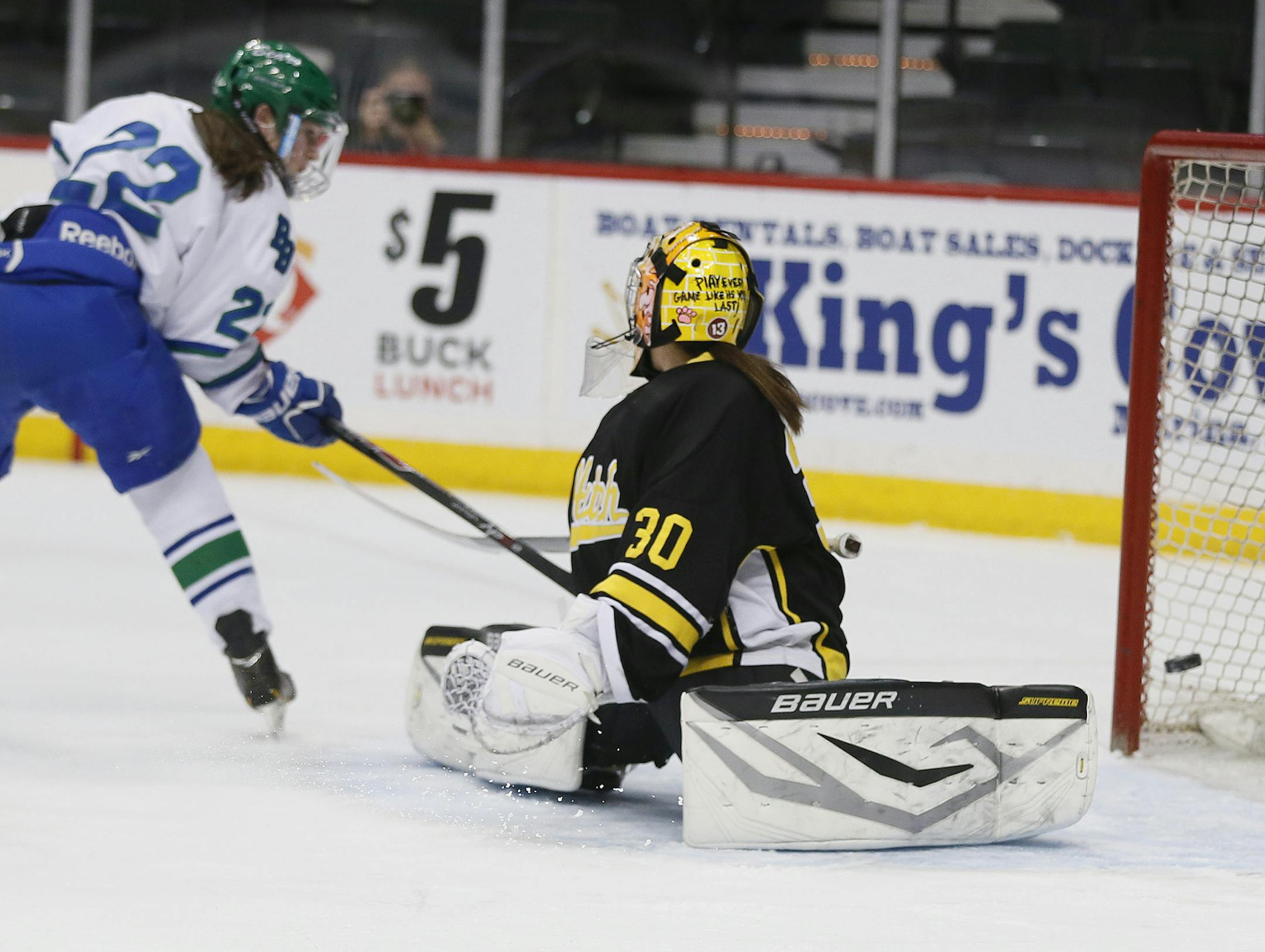Carly Bullock of Blake scored a first period goal over goal keeper Ellie Lenarz of Hutchinson. Blake played Hutchinson in the Class 1A hockey quarterfinals at Xcel Energy Center Wednesday February 18, 2015 in St. Paul, MN. ] Jerry Holt/ Jerry.Holt@Startribune.com
