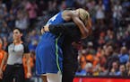 Minnesota Lynx center Sylvia Fowles (34) embraces her coach Cheryl Reeve as she leaves for the final time Sunday.