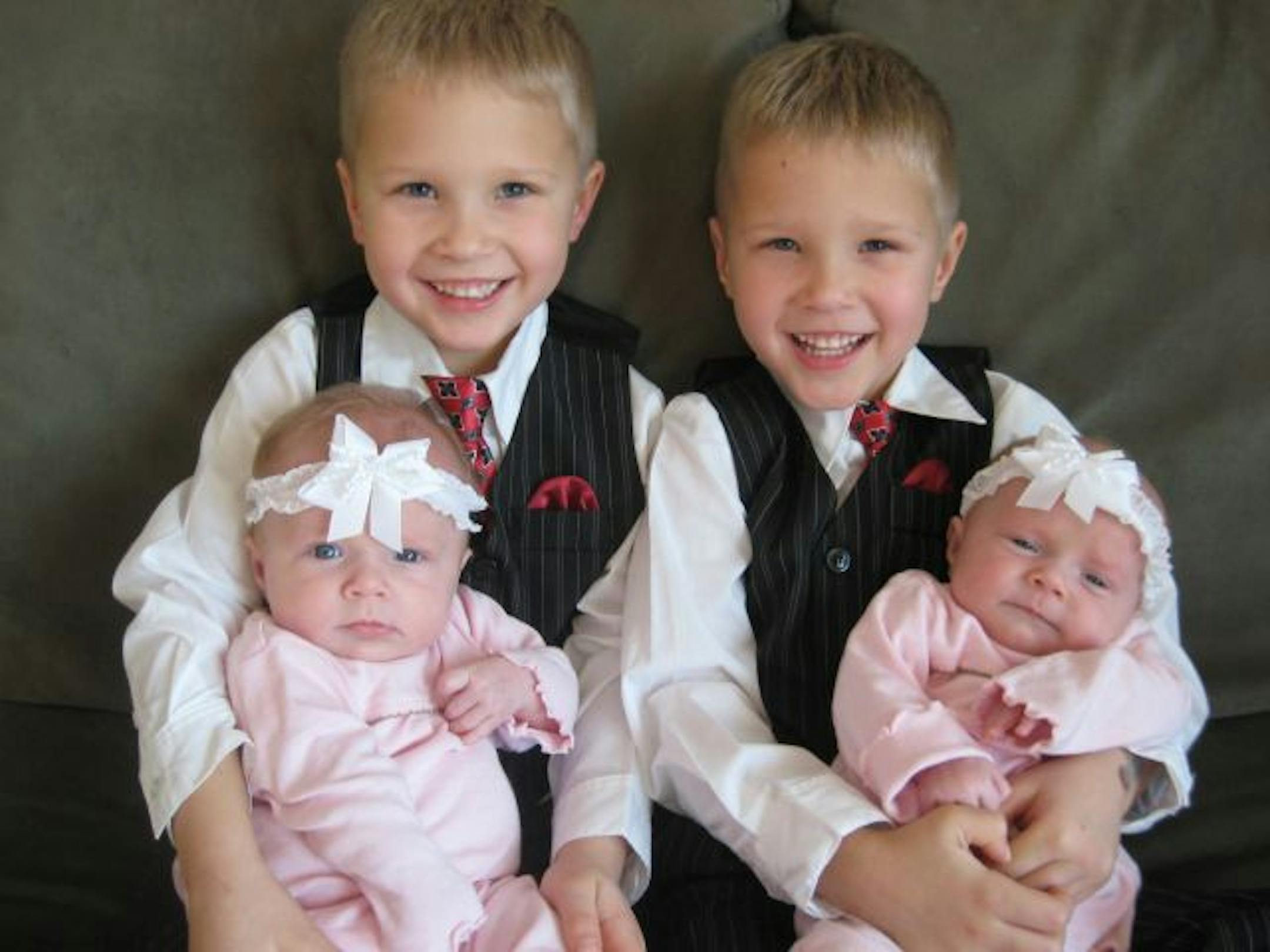 The Rehovsky kids: Ayden, left, held baby sister Tatum, and Evan held her twin, Molly.