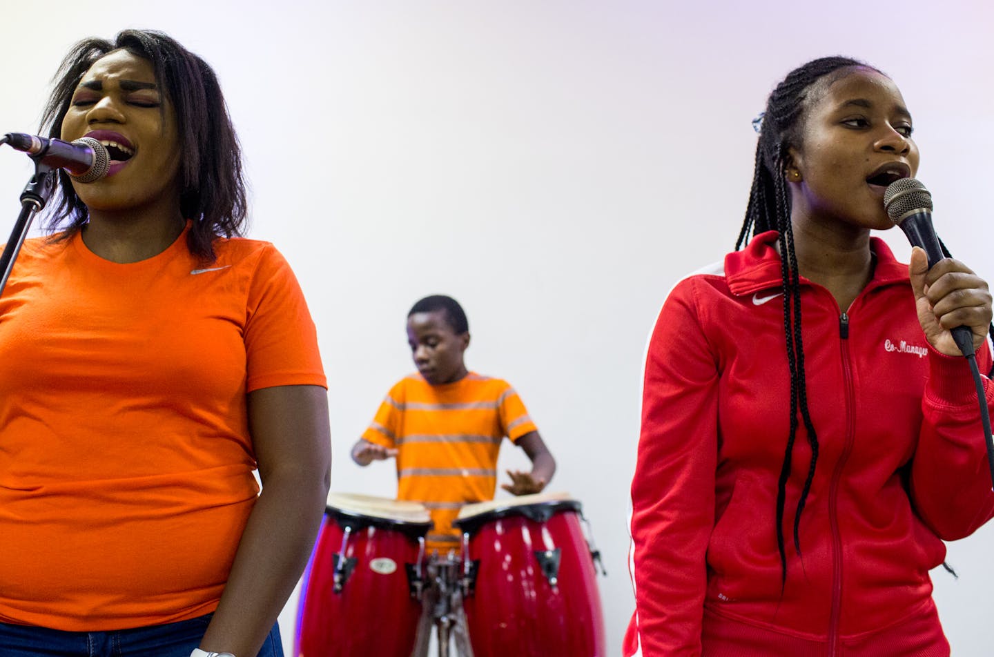 Lydia, Believe and Gloria Mihigo (from left to right) perform while people enter the church service for African refugees, at Bethel Christian Fellowship Church. ] COURTNEY PEDROZA &#x2022; courtney.pedroza@startribune.com; Bethel Christian Fellowship Church is hosting its weekly Sunday worship for African refugees; Aug. 13, 2017; Congolese refugees; St. Paul