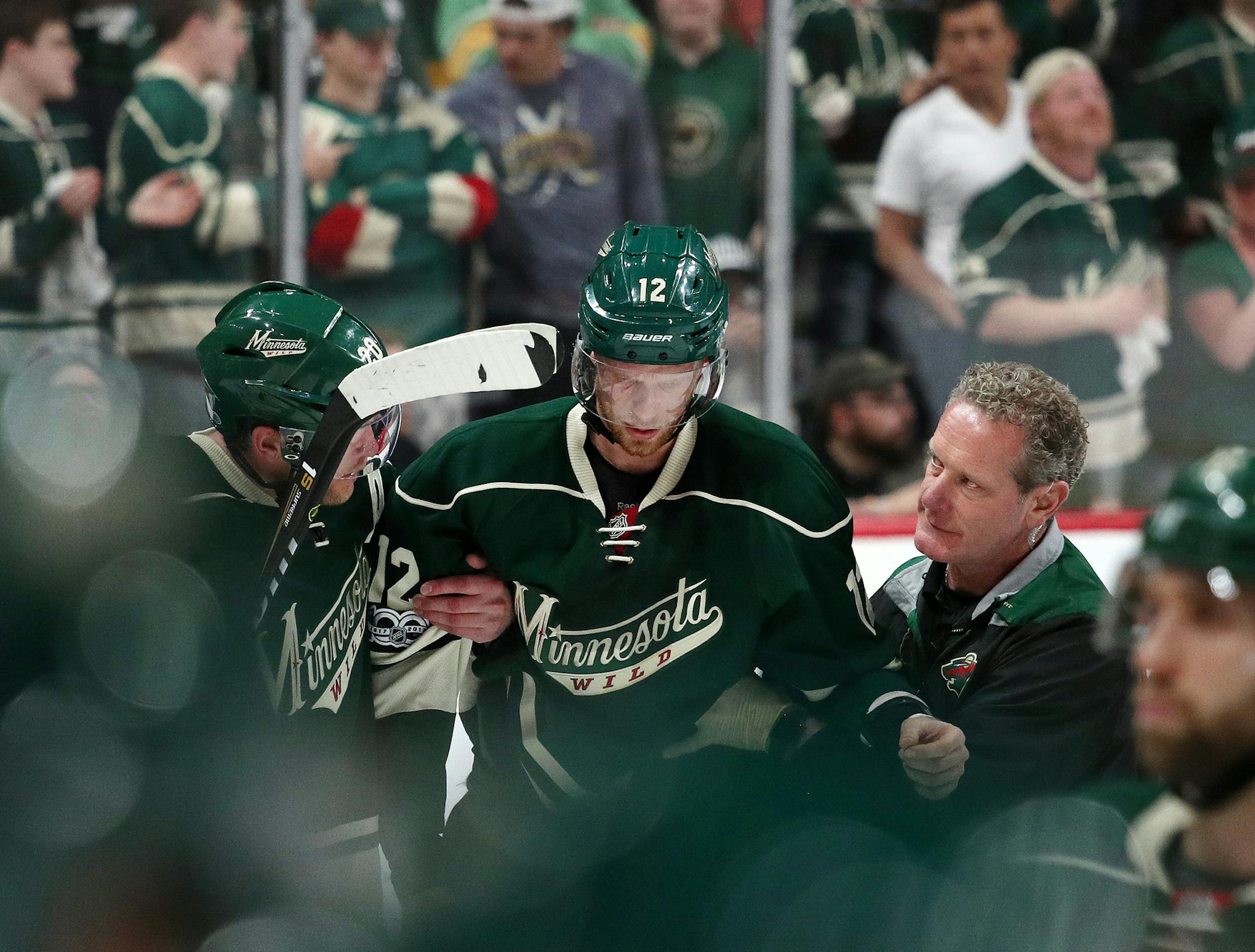 Minnesota Wild center Eric Staal (12) was helped off the ice after suffering an injury from crashing into the boards in the second period. ] ANTHONY SOUFFLE ï anthony.souffle@startribune.com Game action from a National Hockey League (NHL) playoff game 5 between the Minnesota Wild and the St. Louis Blues Saturday, April 22, 2017 at the Xcel Energy Center in St. Paul, Minn.