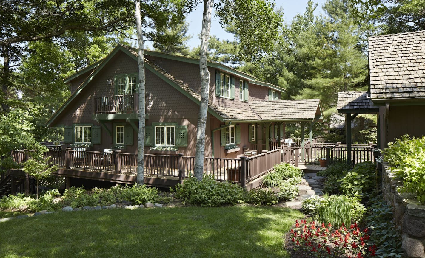 Big shed dormers created space for an upstairs master suite inside the 1950s home above the St. Croix River in Wisconsin.