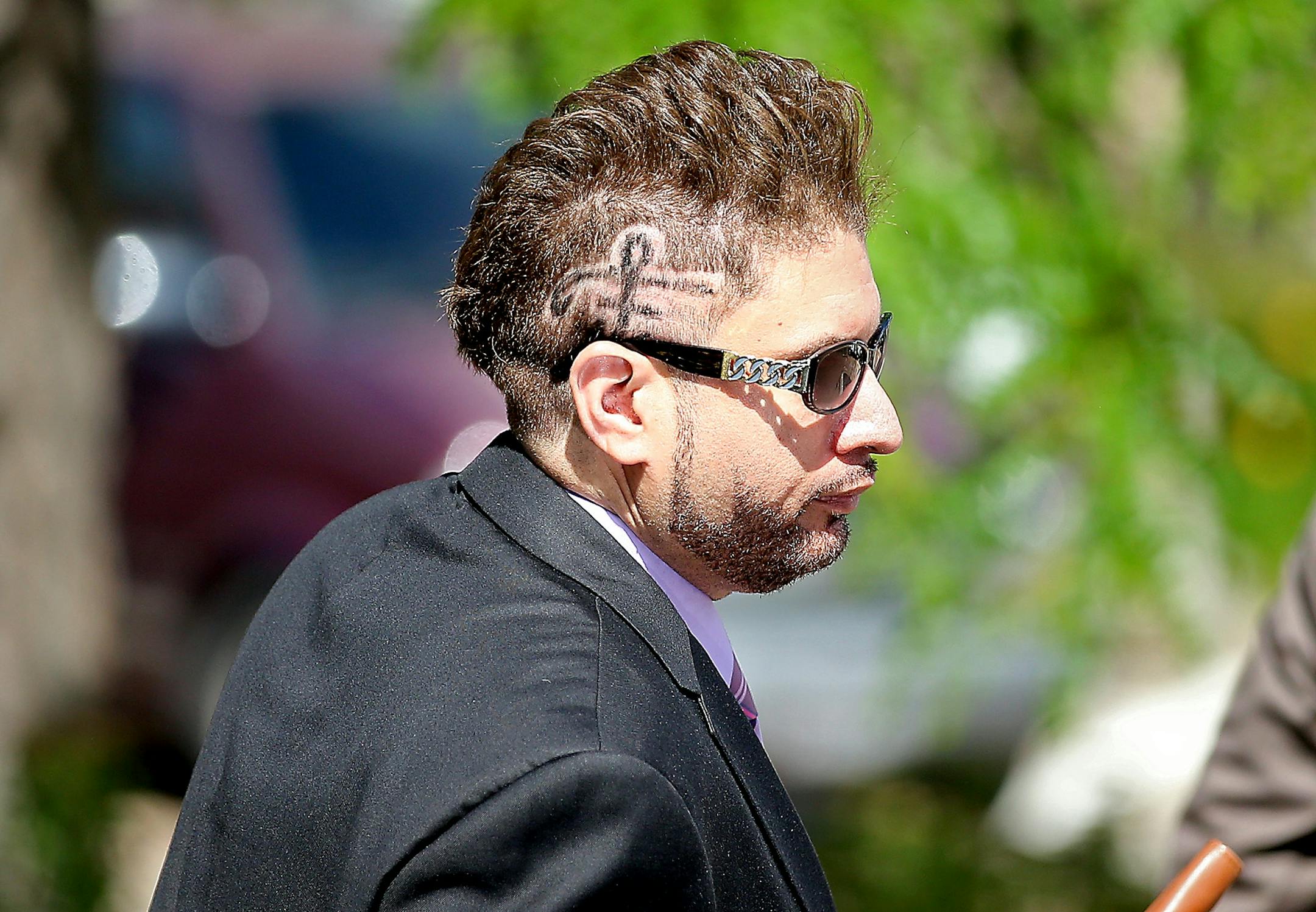With a Prince sign shaved on his head, Prince's half-brother Omarr Baker left the Carver County Justice Center on June 27, 2016 in Chaska, MN. Attorneys representing the potential heirs to Prince's estate met in court to discuss issues related to DNA testing of those making a claim to the late musician's music and millions.