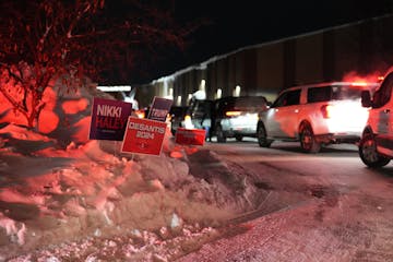 Signs for Republican presidential candidates are seen outside of the Horizon Event Center, a caucus location, on Caucus Day in Clive, Iowa, on Monday,