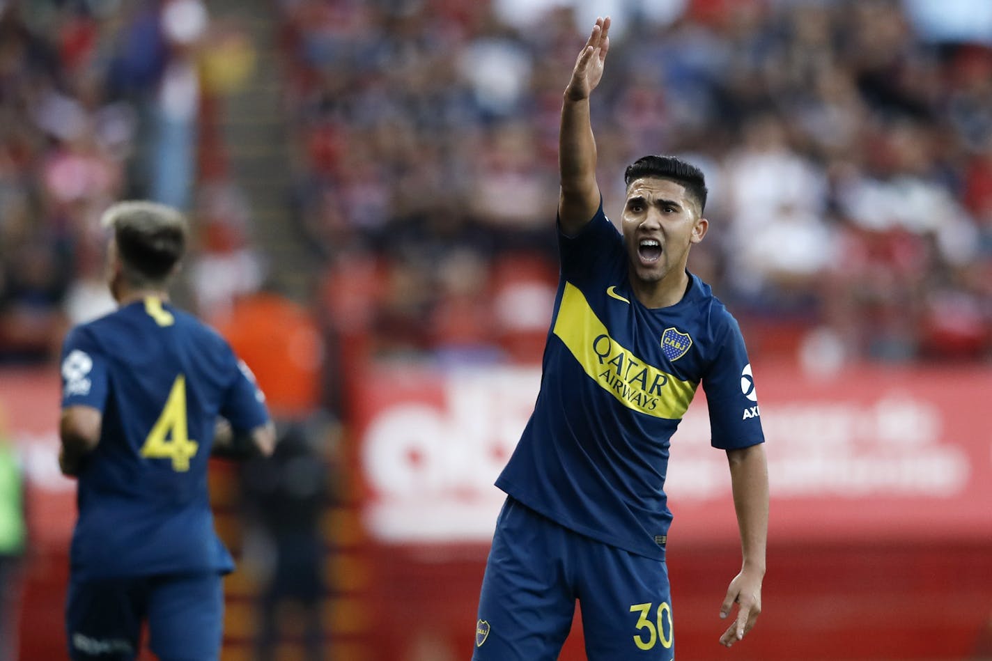 Boca Juniors's Emanuel Reynoso, right, gestures during the first half of a friendly soccer match against Tijuana, Wednesday, July 10, 2019, in Tijuana, Mexico. (AP Photo/Gregory Bull) ORG XMIT: MXGB104