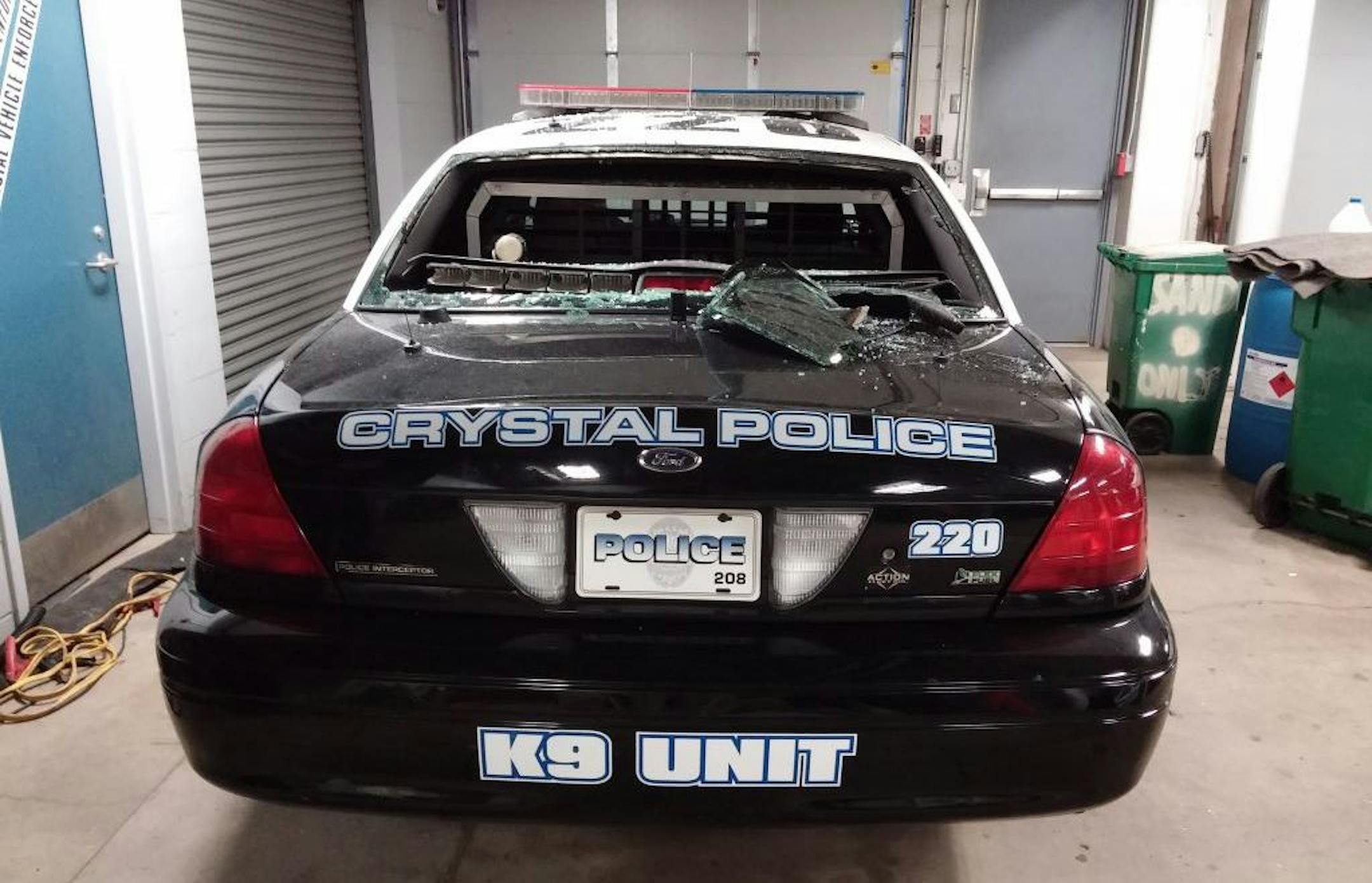 Photo courtesy of Crystal Polcie Department: The car damaged by a rock. A police canine was inside.