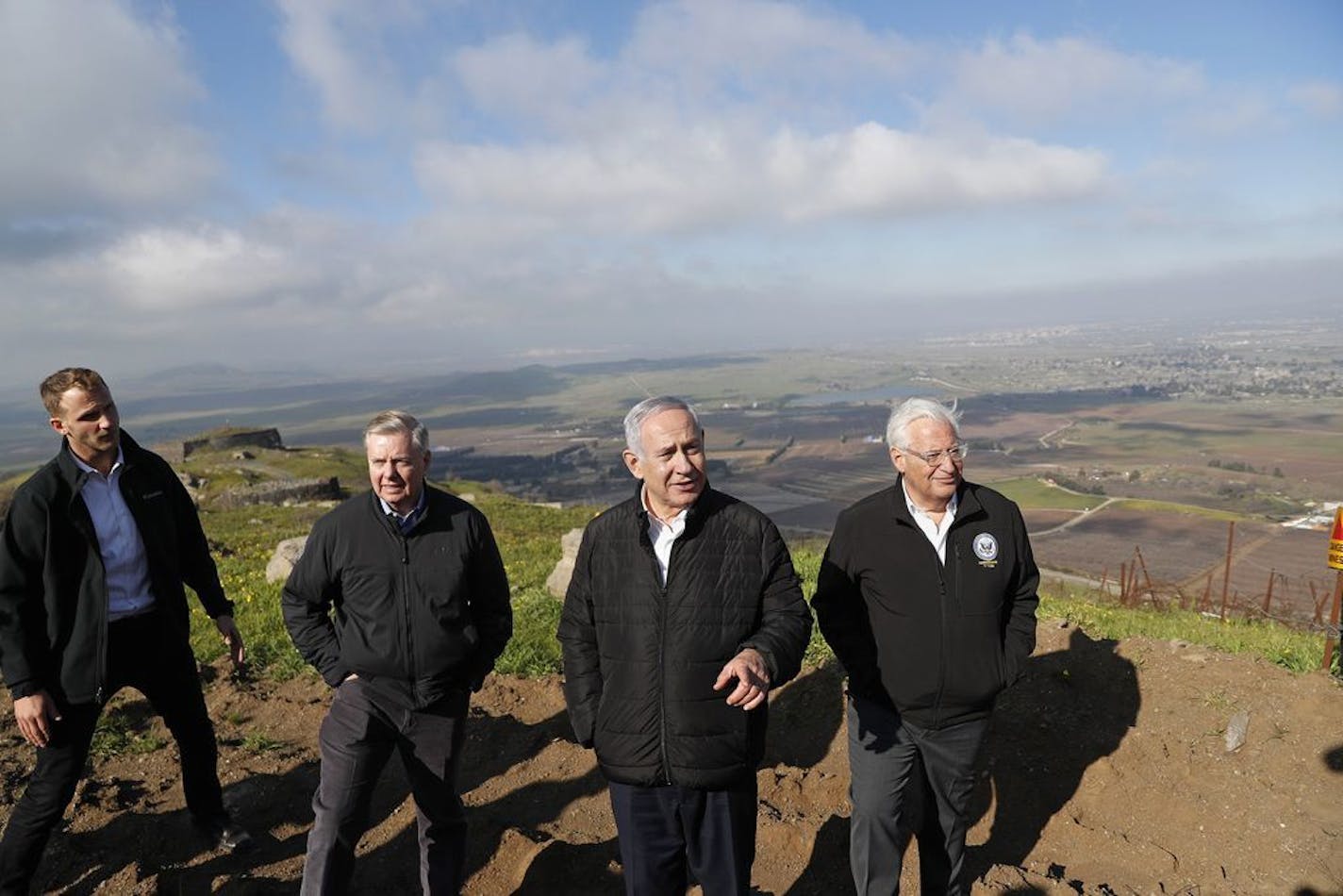 Israeli Prime Minister Benjamin Netanyahu, center, Republican U.S. Senator Lindsey Graham, second left, and U.S. Ambassador to Israel David Friedman, right, visit the border between Israel and Syria at the Israeli-held Golan Heights, Monday, March 11, 2019. Graham says he will push for American recognition of Israeli sovereignty over the Golan Heights, a territory it captured from Syria in the 1967 Mideast war.