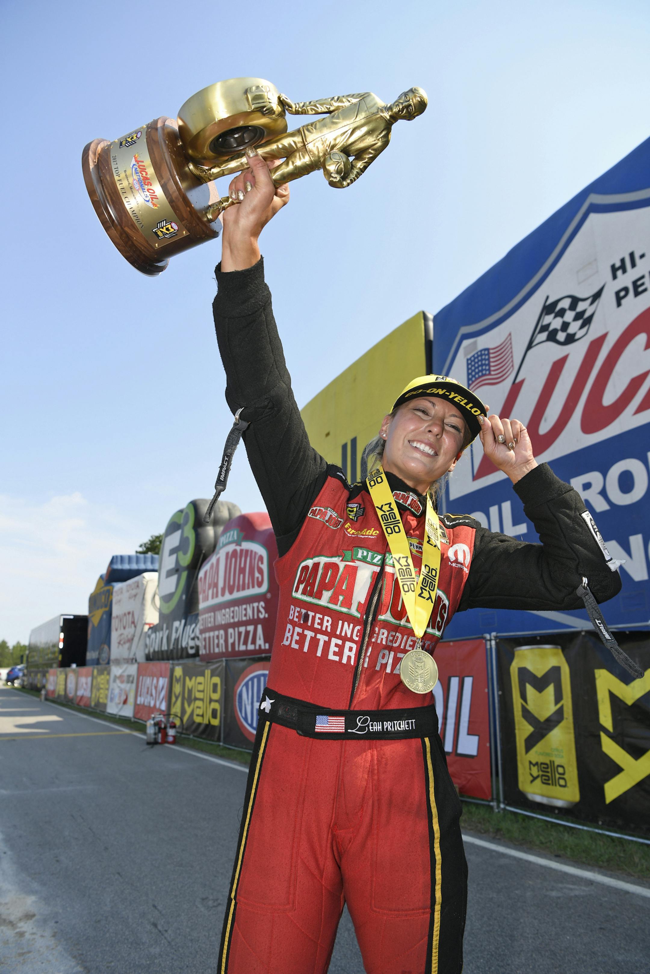In this photo provided by NHRA, Leah Pritchett celebrates her win over Antron Brown in Top Fuel at the Lucas Oil NHRA Nationals drag races at Brainerd International Raceway on Sunday, Aug. 20, 2017, in Brainerd, Minn. (Jerry Foss/NHRA via AP)