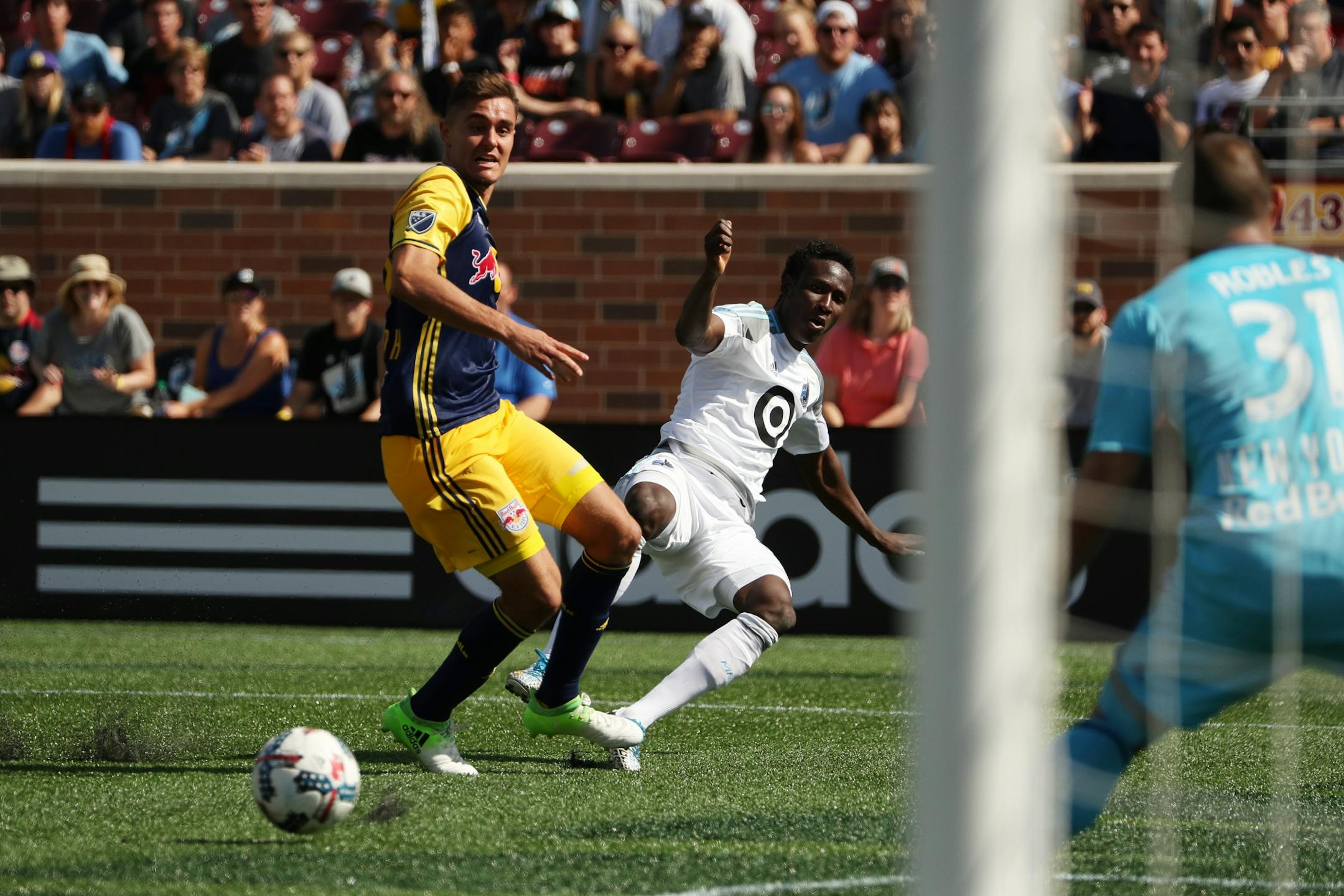 Minnesota United forward Abu Danladi (9) was taken down by New York Red Bulls midfielder Aaron Long (33) as he dribbled to the goal in the second half.