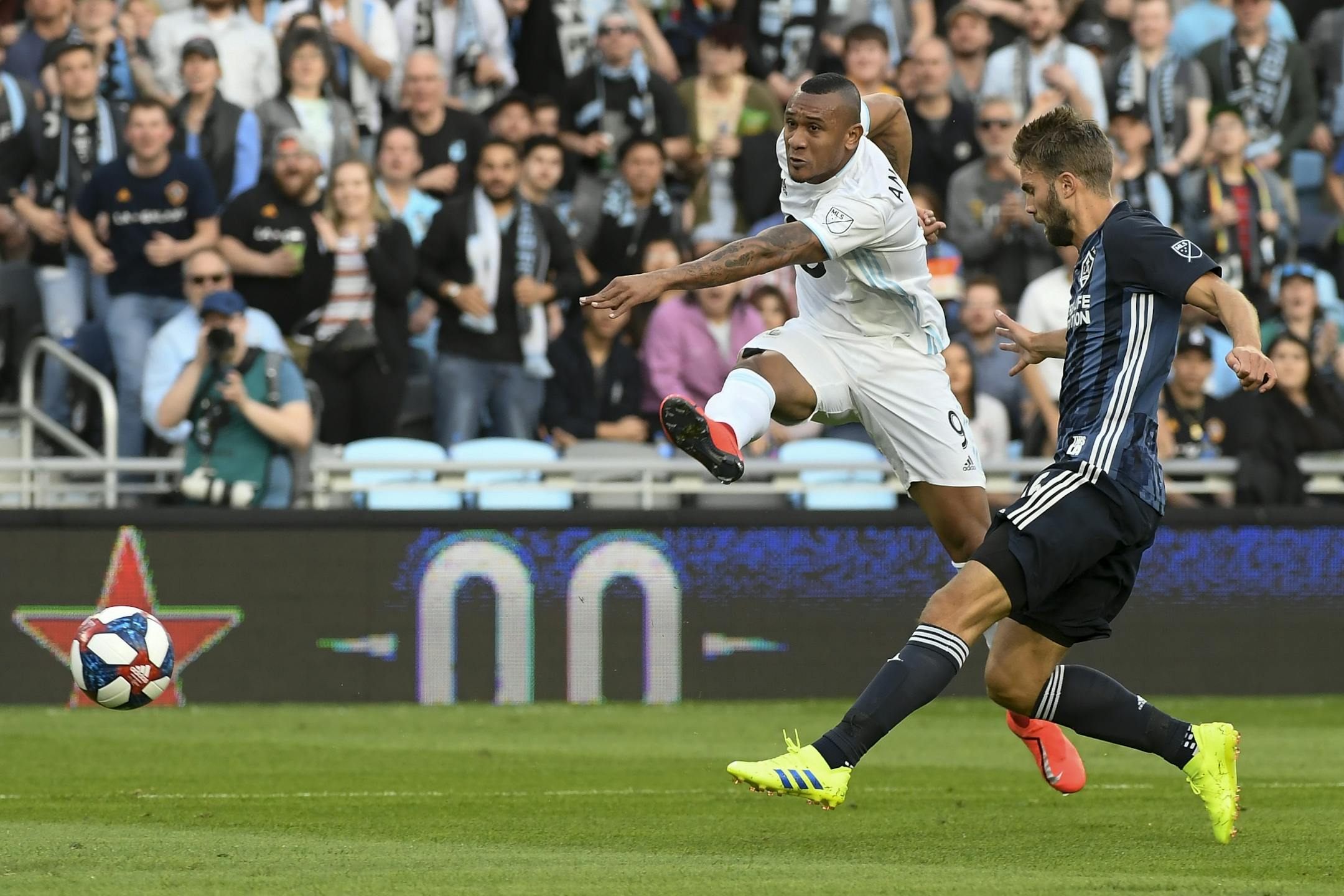Minnesota United forward Angelo Rodriguez (9) attempted a shot as he was defended by Los Angeles Galaxy defender Jorgen Skjelvik (16) in the first half.