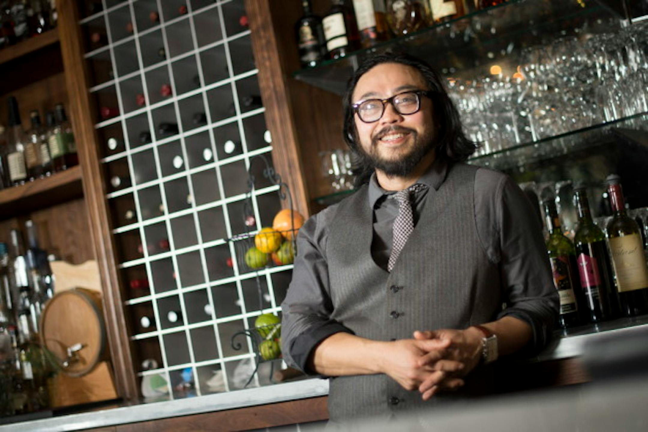 Hai Truong, chef and owner of Ngon Vietnamese Bistro in St. Paul, is pictured behind the bar on Friday afternoon.  ] (Aaron Lavinsky | StarTribune) aaron.lavinsky@startribune.com  Great Chefs profile on Hai Truong, chef and owner of Ngon Vietnamese Bistro in St. Paul. A self-taught chef, a motorcycle and car gearhead, a father and maker of the Twin Cities' best pho. Truong was photographed Friday, April 17, 2015 in St. Paul