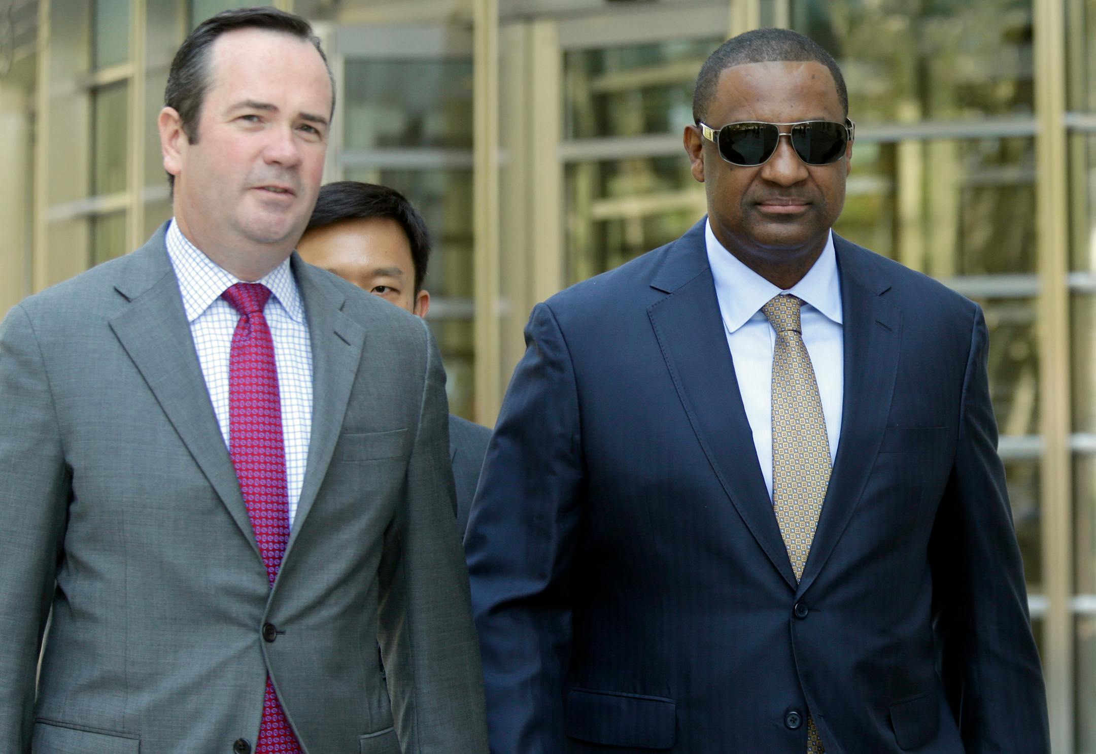 Former FIFA vice president Jeffrey Webb, right, leaves Brooklyn federal court with his attorney Edward O'Callaghan, Friday, Aug. 14, 2015, in New York. Webb is one of 14 people indicted in May in the U.S. Justice Department's investigation into corruption at FIFA. (AP Photo/Mary Altaffer)
