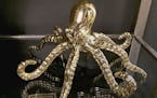 Gilded Home offered this baby octopus for a bookshelf or table top in a gold finish. (Patricia Sheridan/Pittsburgh Post-Gazette/TNS) ORG XMIT: 1186326
