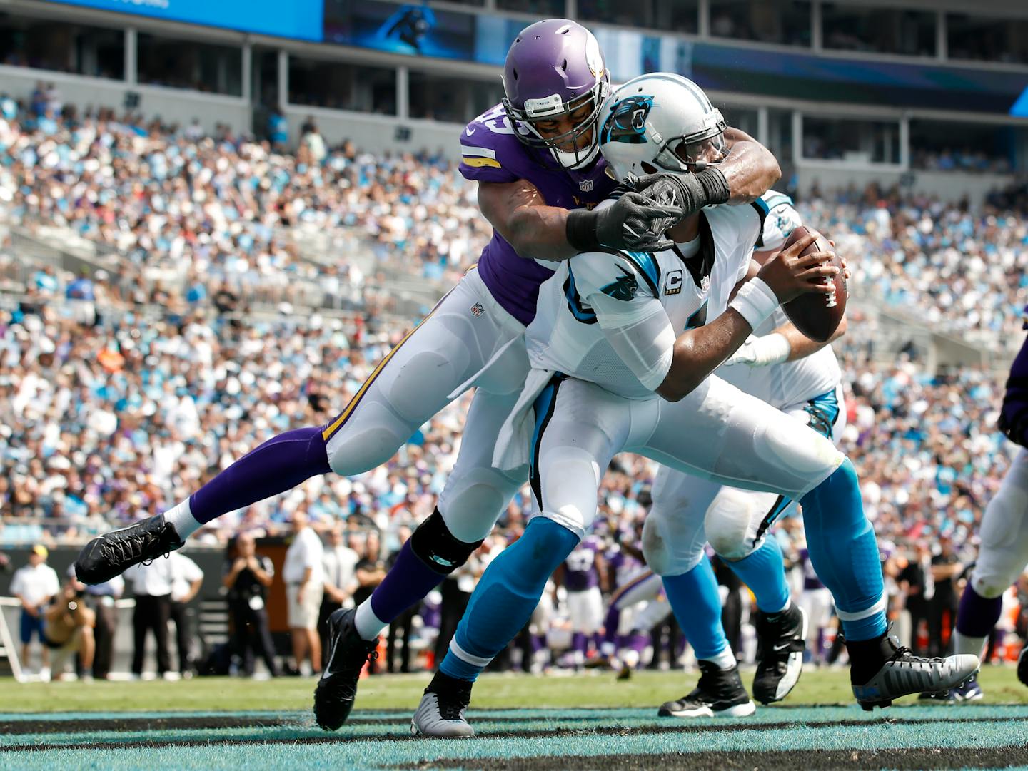 Danielle Hunter (99) sacked Cam Newton (1) in the end zone for a safety in the first quarter.