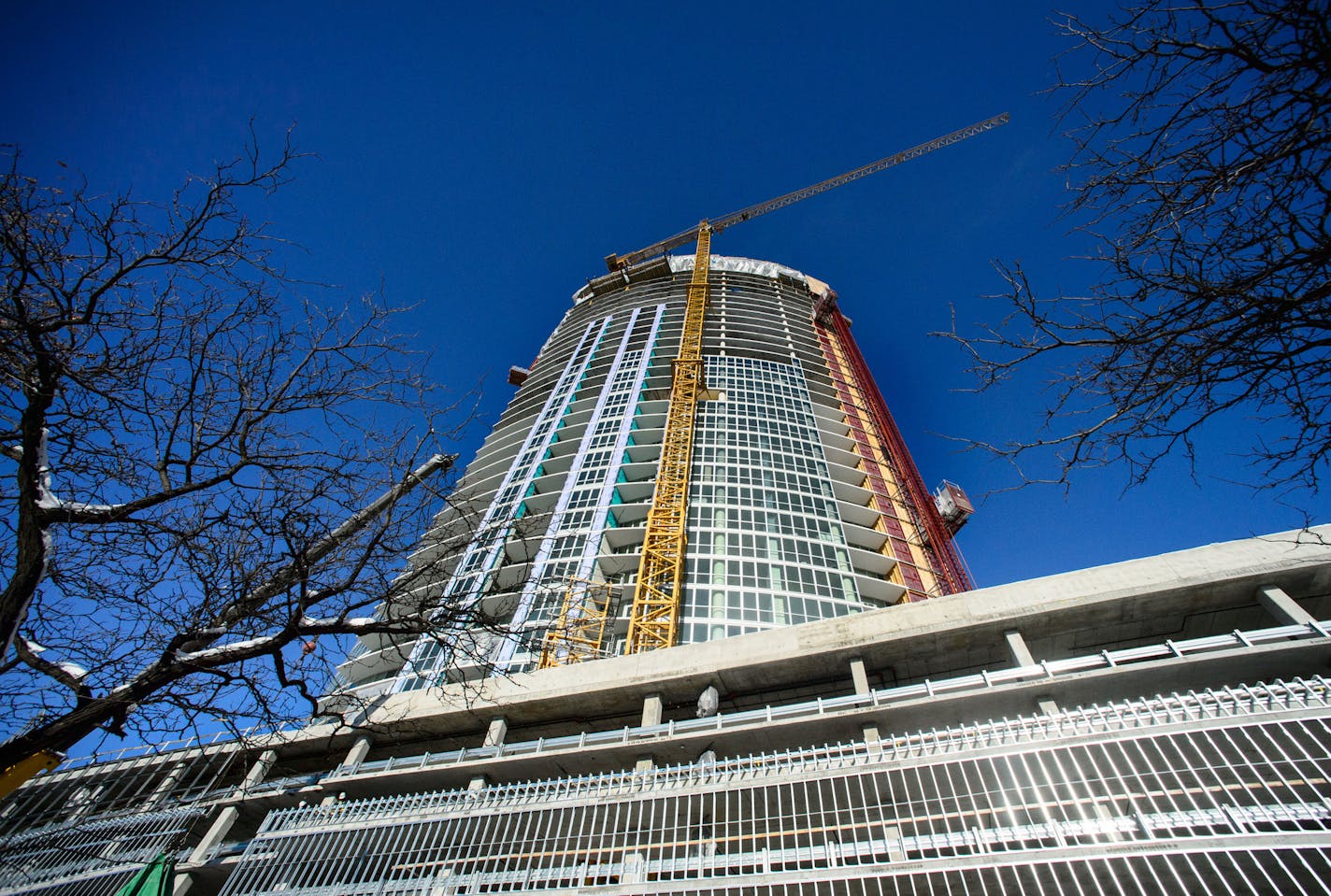 A Christmas tree was raised to the top of LPM Apartments, a 36-story apartment building being built in Loring Park. The tree is raised to the top of a new building signifying the completion of the building's structure. Tuesday, December 10, 2013 ] GLEN STUBBE * gstubbe@startribune.com