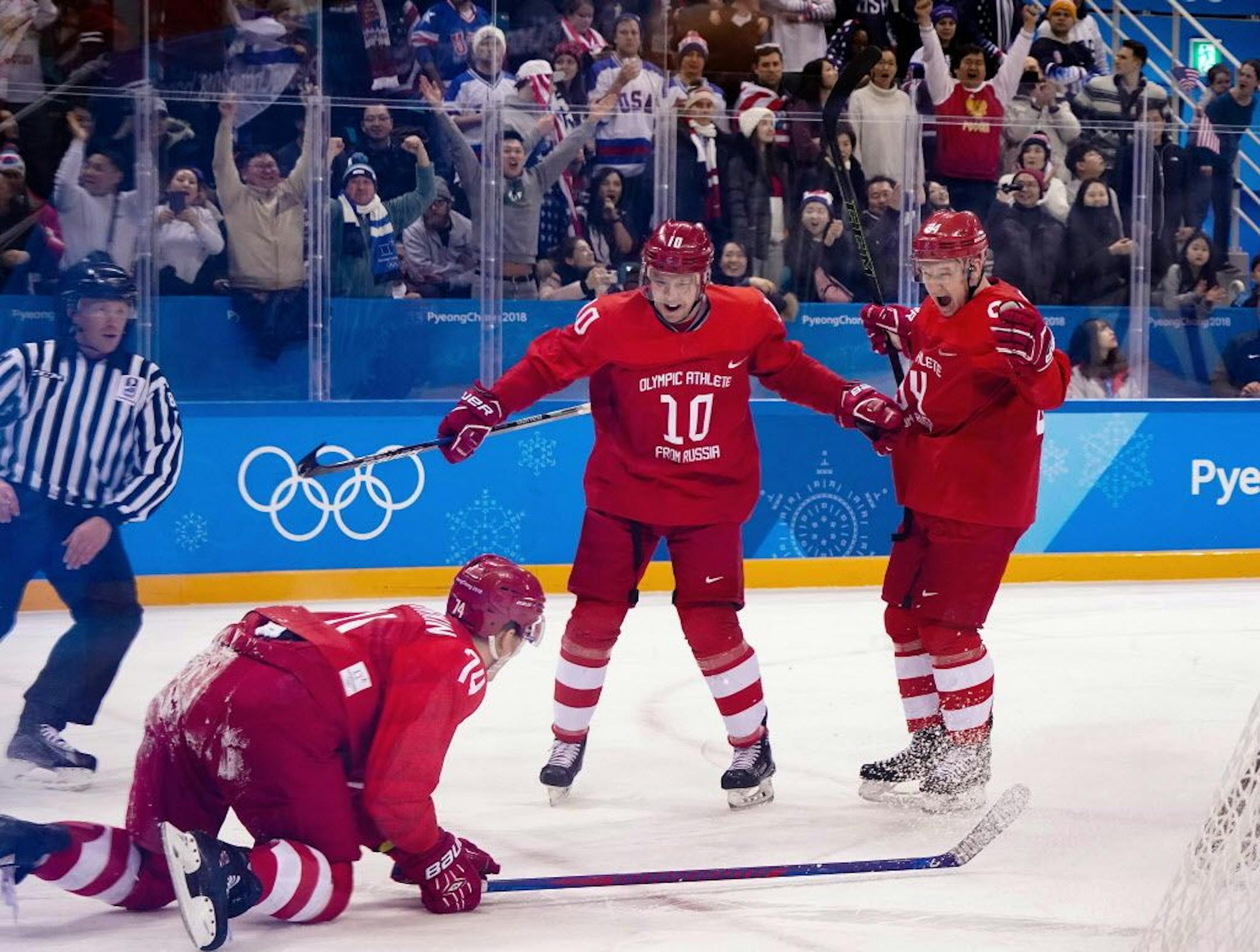 Russian athletes celebrate after scoring a goal against the U.S. team in a preliminary men's hockey match at the 2018 Winter Olympics in the Gangneung Hockey Centre in Gangneung, South Korea, Feb. 17, 2018.