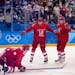 Russian athletes celebrate after scoring a goal against the U.S. team in a preliminary men's hockey match at the 2018 Winter Olympics in the Gangneung
