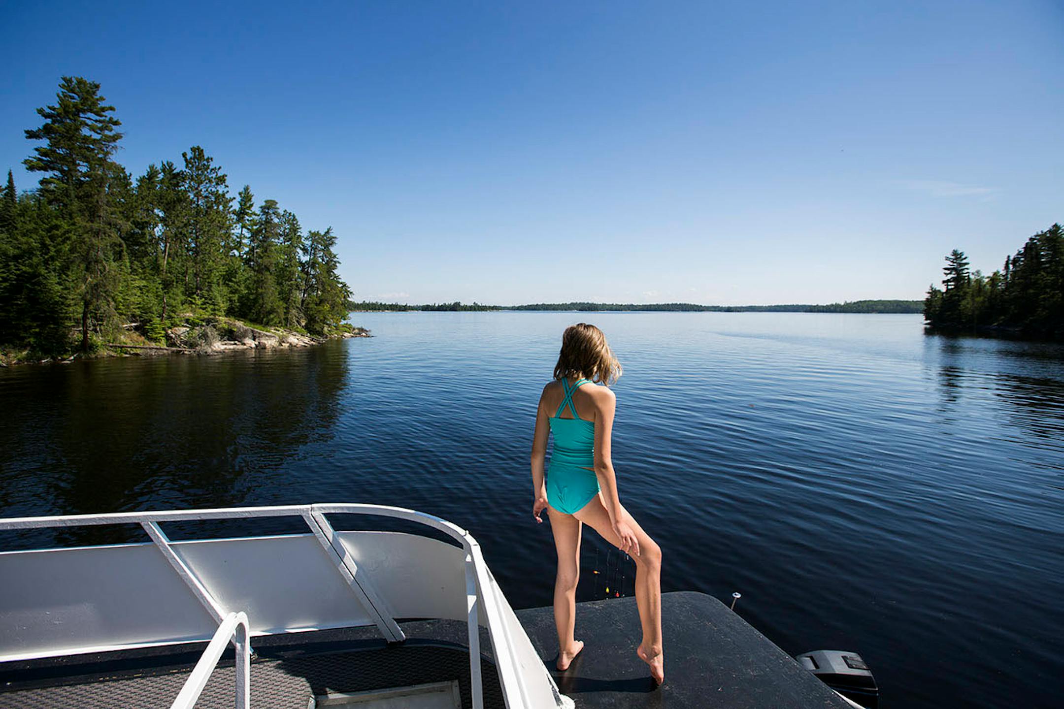Jordan Nypan, 10, of Andover checked out the view of Namakan Lake from the top of her family's houseboat parked on Namakan Island.