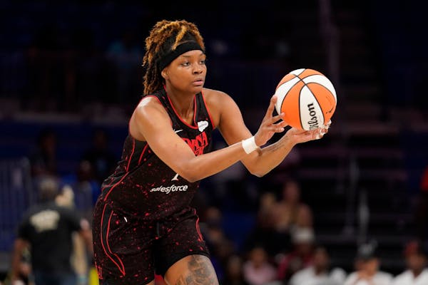 Indiana Fever's NaLyssa Smith makes a pass during a WNBA basketball game against the Dallas Wings, Friday, June 24, 2022, in Arlington, Texas. (AP Pho