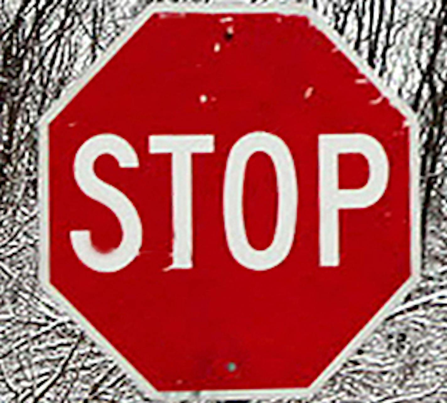 A stop sign is almost buried by several feet in a Fredon, N.J., neighborhood Thursday March 5, 2015, as another storm passes through Sussex County.