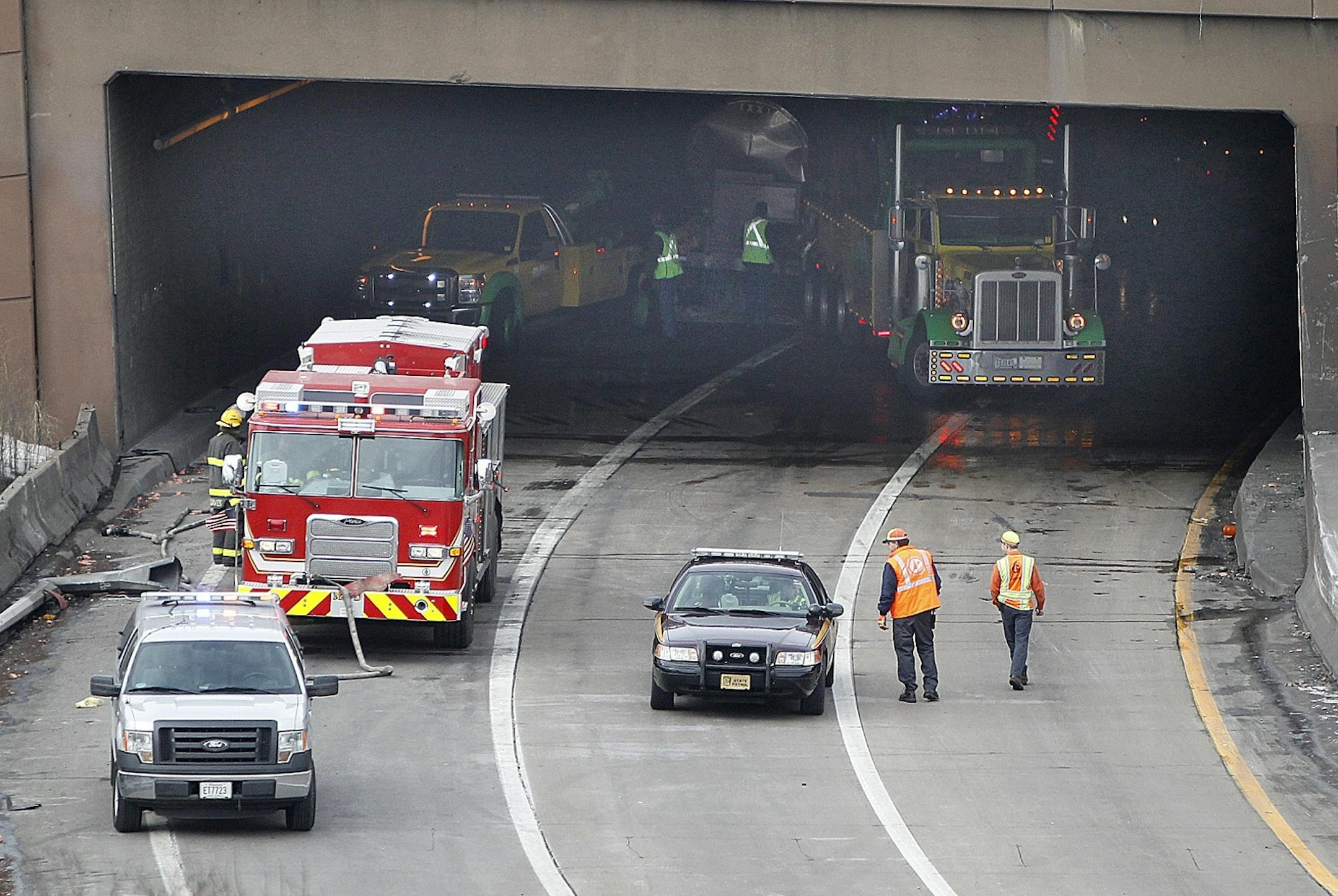Authorities worked on removing a tanker carrying milk from the Lowry Hill Tunnel after it over turned, Wednesday, February 27, 2013 in Minneapolis, MN. The accident forced them to close the eastbound lanes of Interstate 94 for several hours. (ELIZABETH FLORES/STAR TRIBUNE) ELIZABETH FLORES � eflores@startribune.com
