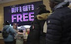 Shoppers stand in line to make Black Friday discount purchases at Bath and Bodyworks, Friday Nov. 29, 2019, in Brooklyn, N.Y. The National Retail Fede