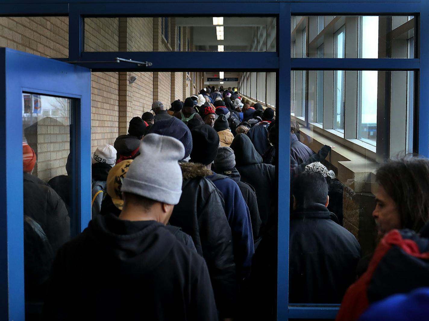 The line for lunch at Sharing & Caring Hands Tuesday, March 24, 2020 in Minneapolis.