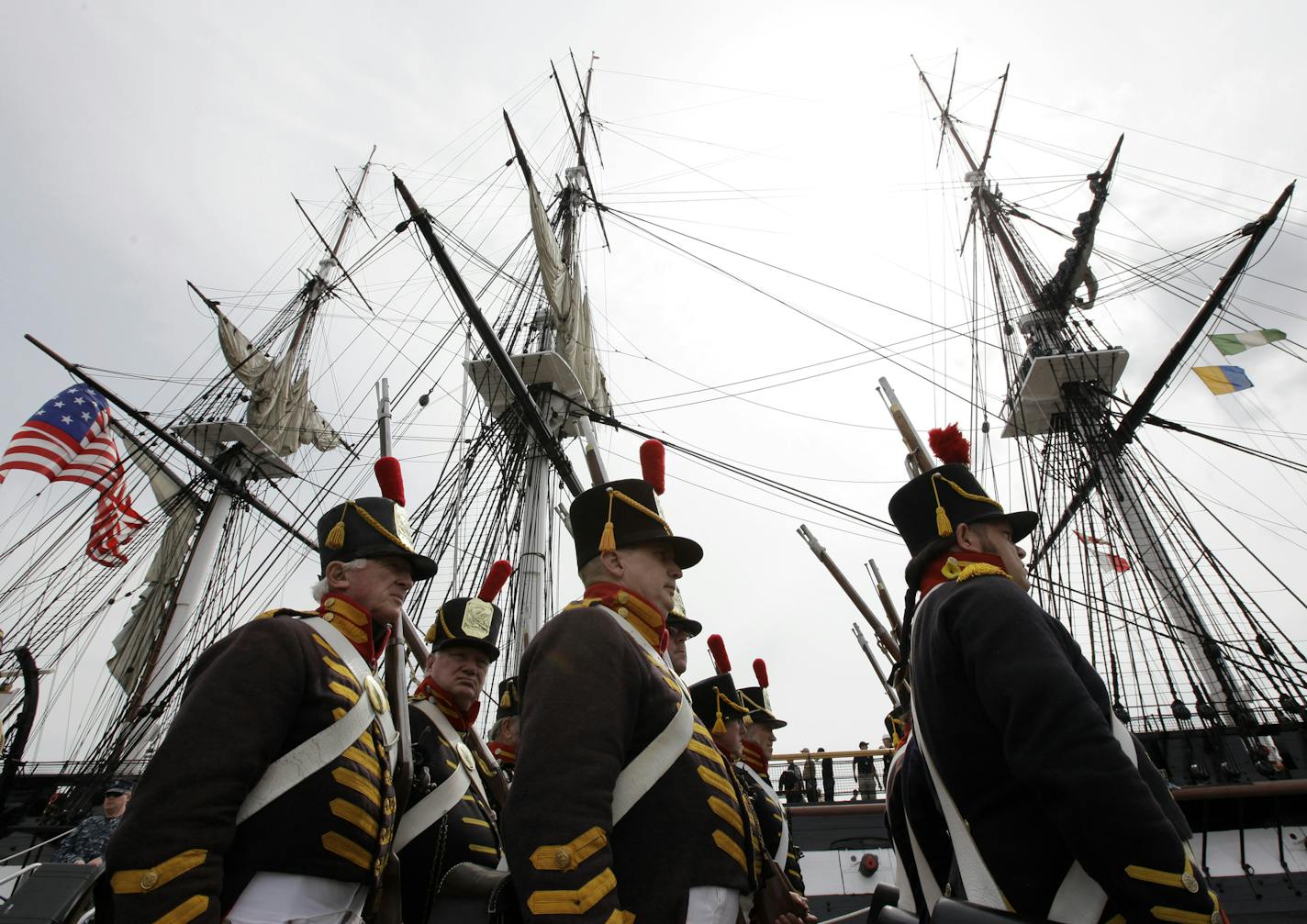 FILE - This Aug. 19, 2012 file photo shows military re enactors in the uniforms of U.S. Marines from the War of 1812, marching in front of the USS Constitution, the U.S. Navy's oldest commissioned warship, moments after the vessel arrived at her berth in Charlestown Navy Yard in Boston to commemorate the 200th anniversary of the ship's victory over HMS Guerriere in the War of 1812. One bit of gospel is endlessly recited in the debt limit standoff: The United States has never defaulted. But histo