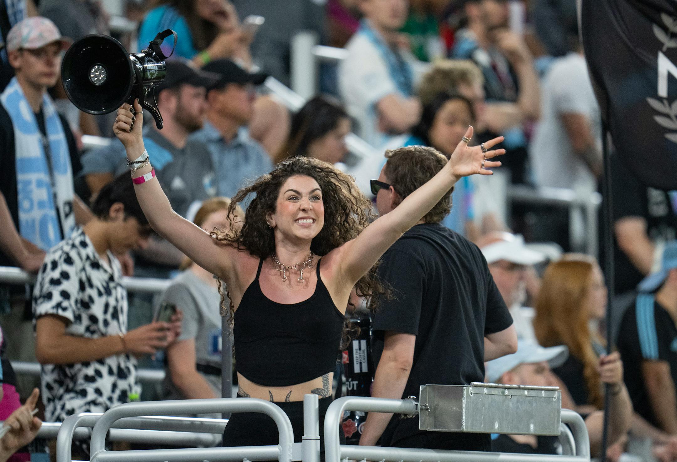 A Minnesota United chant leader encourages fans to shout in the second half of the match against Real Salt Lake.