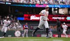 Twins outfielders Max Kepler (26) and Byron Buxton (25) round the bases after Alex Kirilloff hit a three-run home run to give the Twins the lead in th