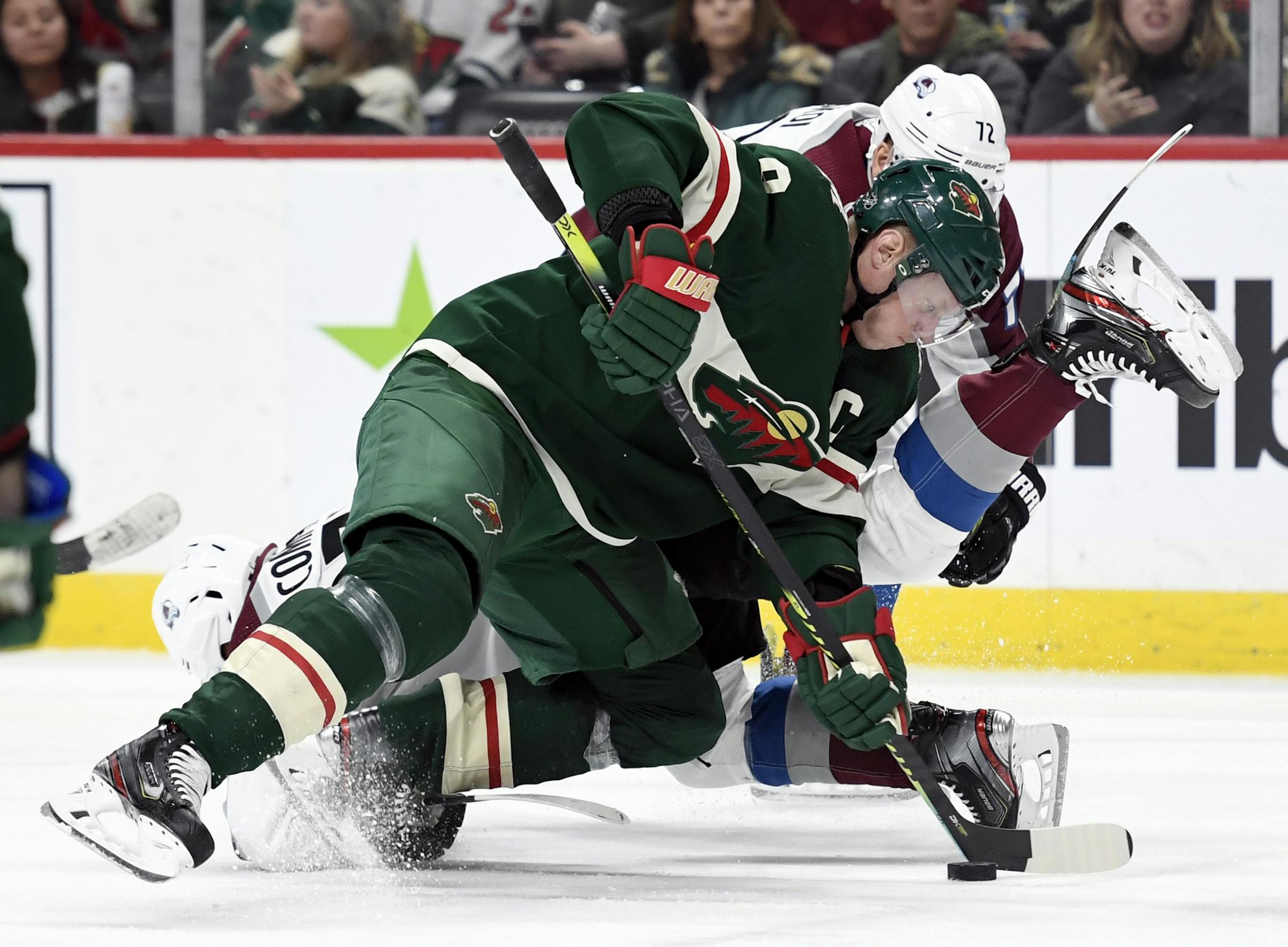 Minnesota Wild's Mikko Koivu (9), of Finland, takes control of the puck after a face-off against the Colorado Avalanche during the second period of an NHL hockey game Sunday, Feb. 9, 2020, in St. Paul, Minn. (AP Photo/Hannah Foslien)