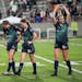 Minnesota Aurora FC's Addison Symonds (16) shows her love to fans next to teammates Elizabeth Rapp (7) and Catherine Rapp (20) after losing 2-1.