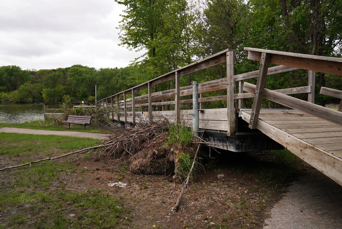 The fishing pier at Fort Snelling State Park was pushed ashore by the rising water at Snelling Lake. ] ANTHONY SOUFFLE &#x2022; anthony.souffle@startribune.com Minnesota DNR officials discussed the flood damage at Fort Snelling Sate Park in a news conference Thursday, May 23, 2019 in St. Paul, Minn. The wet spring continues to cause trouble at Fort Snelling State Park, which remains closed because of high water and damaged infrastructure. Officials are hoping the park can reopen sometime in July